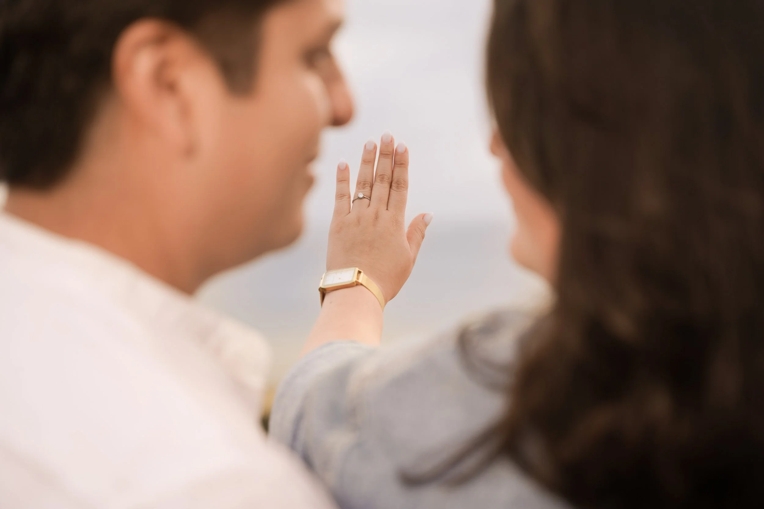 Couple walking at Sunset Cliffs San Diego during sunset engagement session