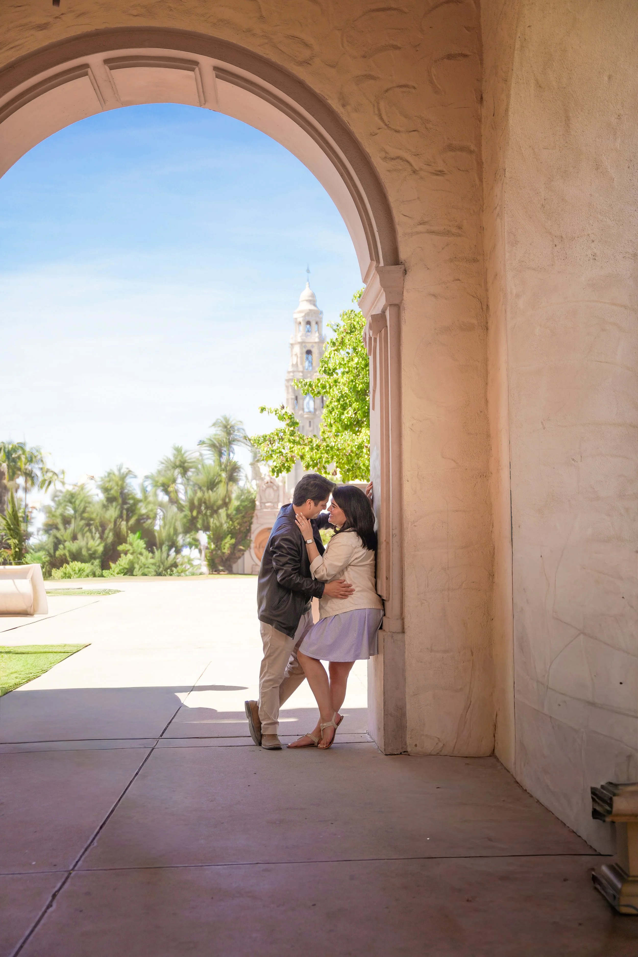 Couple enjoying post-proposal engagement photos in Balboa Park