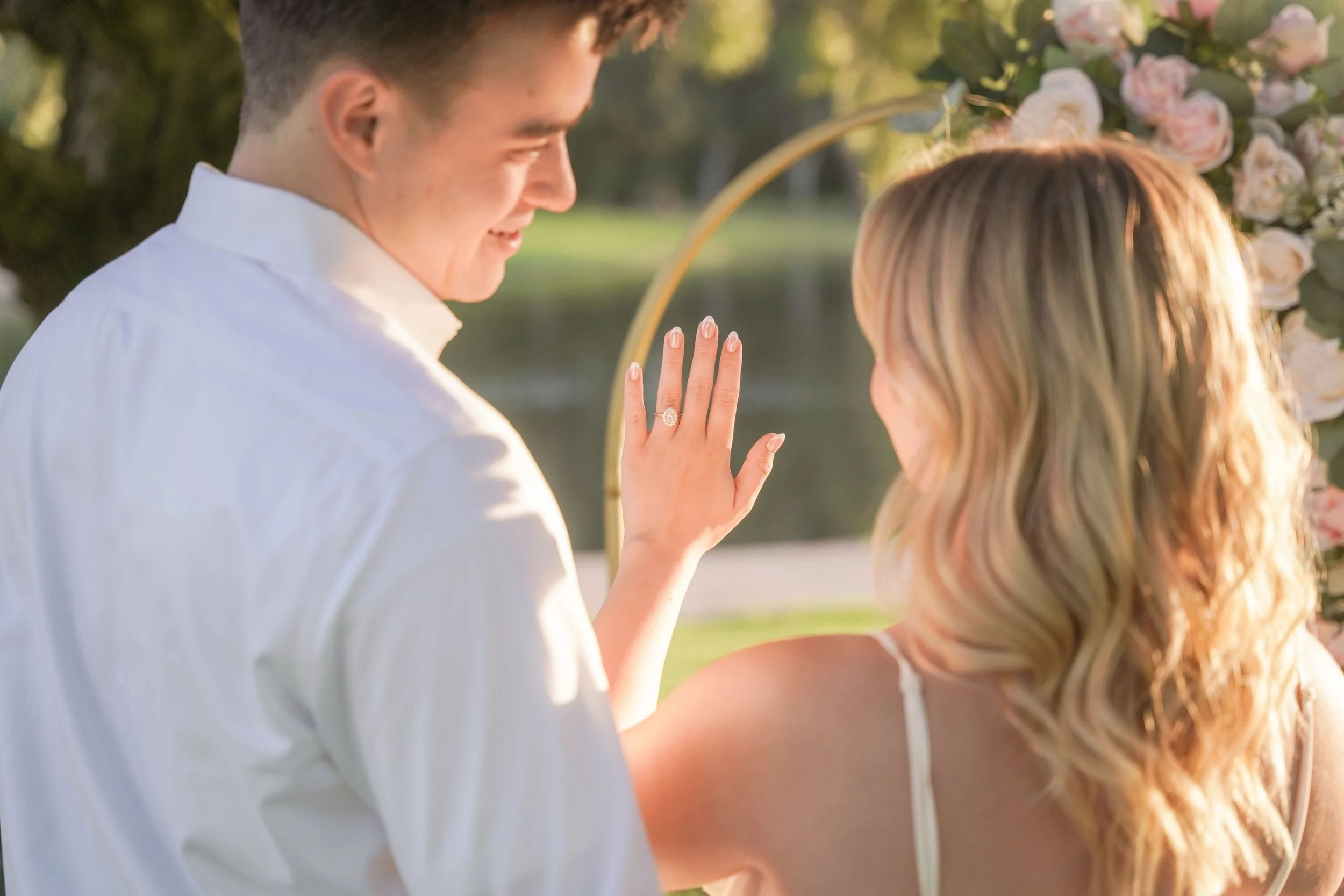 Romantic Engagement Setup with Signature “Yes” Arch