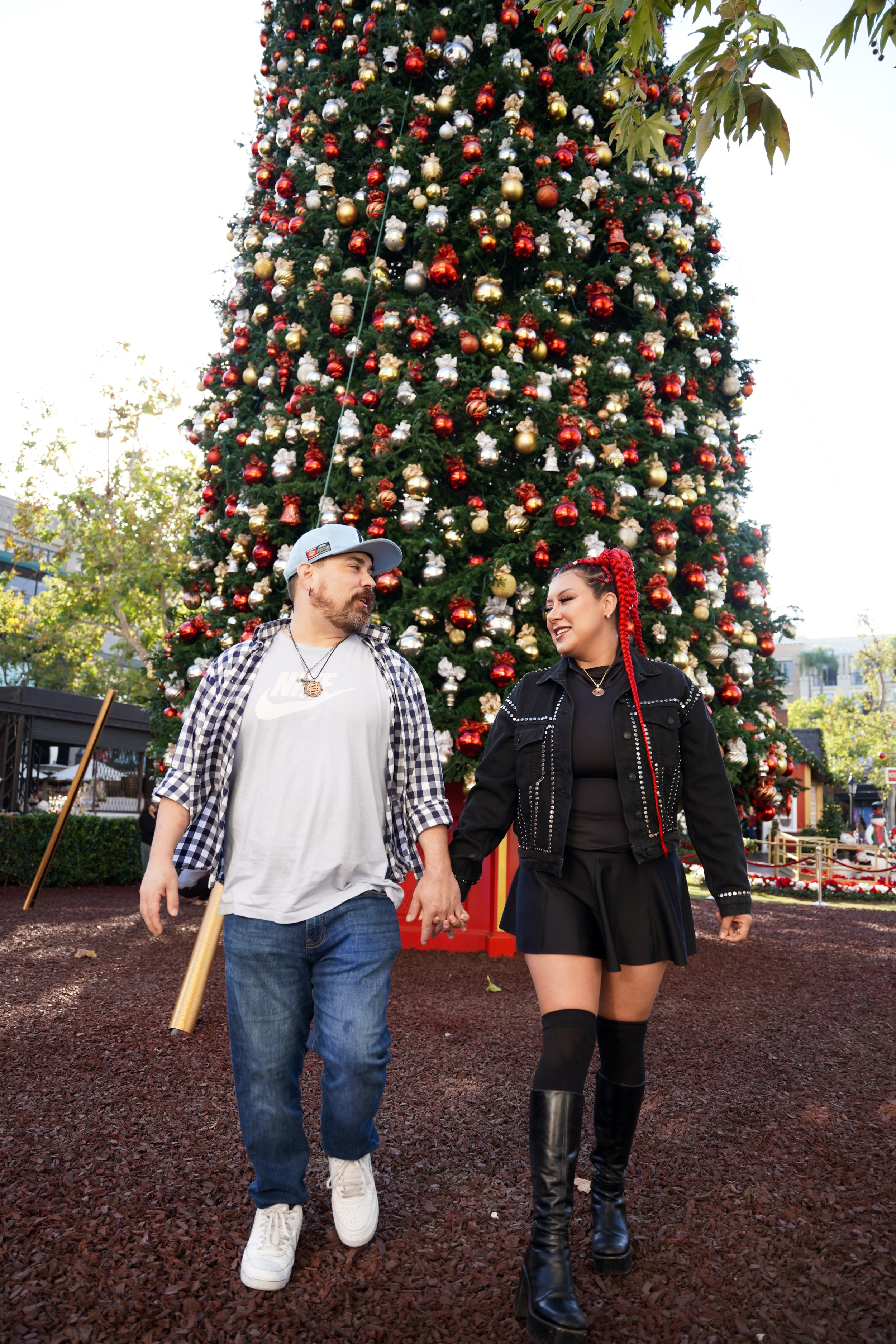 Christmas magic captured beneath the tree, the lights, and each other. This cozy couples shoot celebrated love, laughter, and the quiet joy of the season—a reminder that the best gifts are the moments we share.