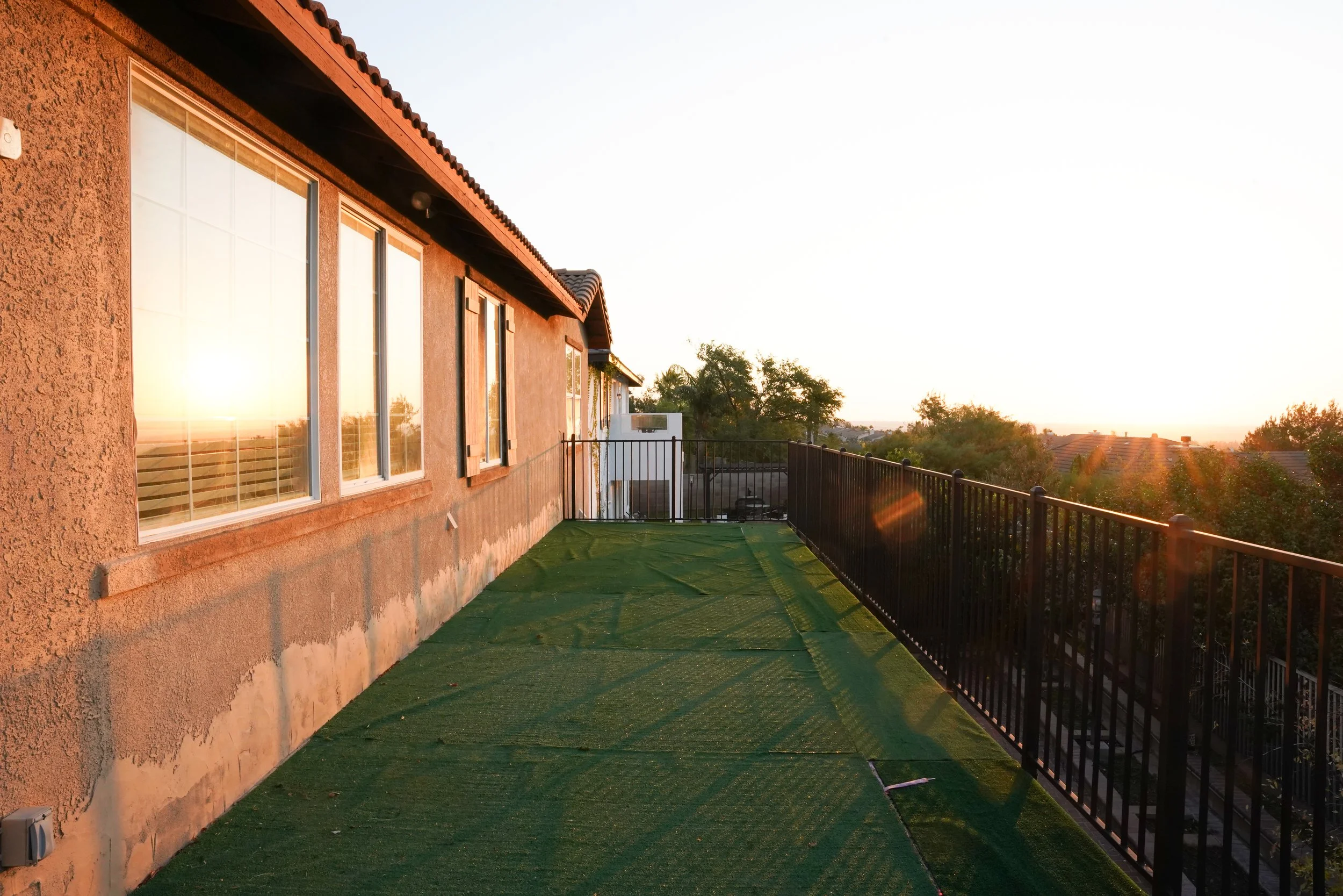 Exterior photo of elevated deck area showcasing outdoor entertaining space for rental listing.