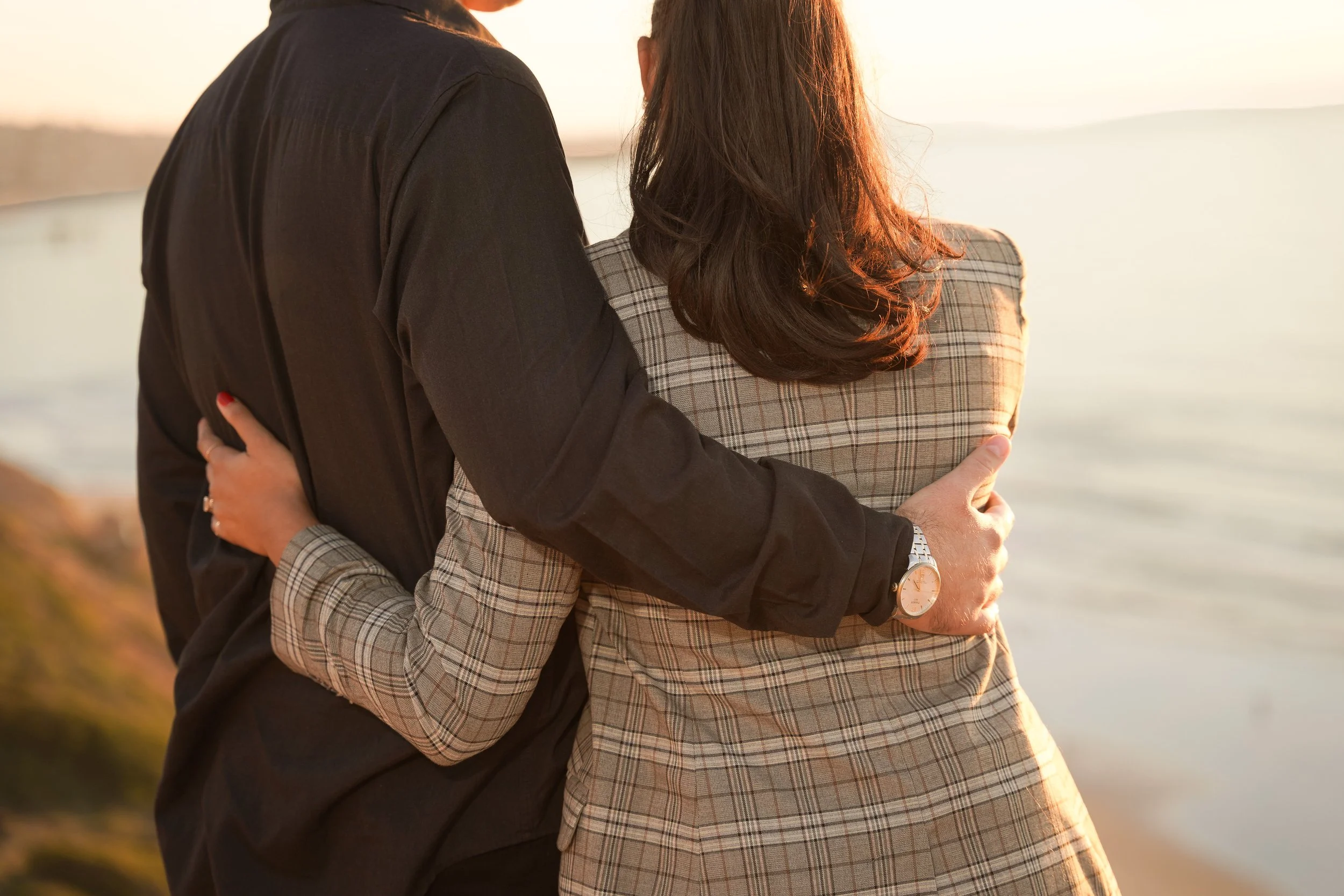 Surprise proposal photography in La Jolla at Gliderport, freezing the moment high school sweethearts made it official.