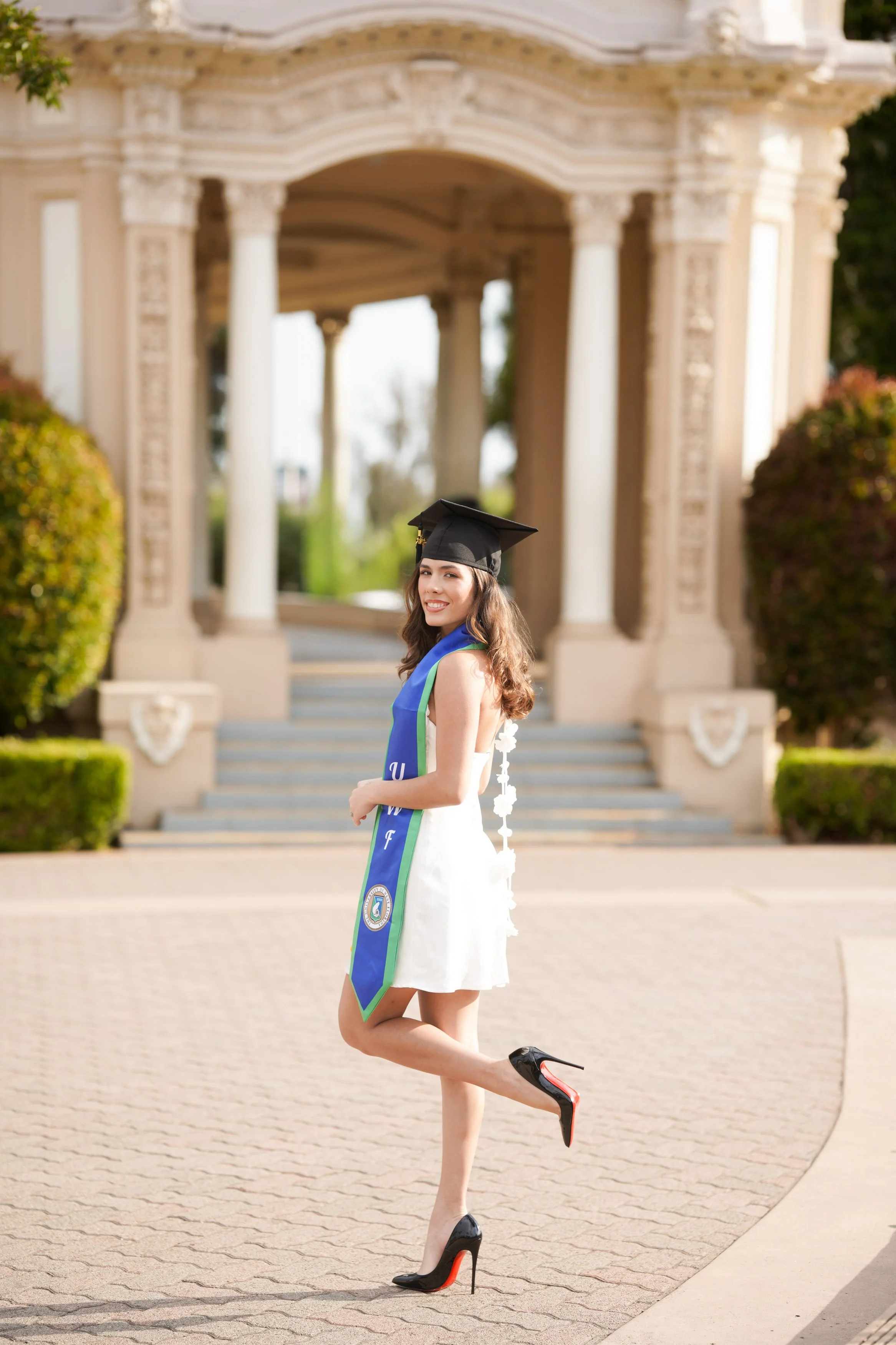 Destination milestone photography for this University of West Florida graduate, celebrated at Balboa Park, San Diego.