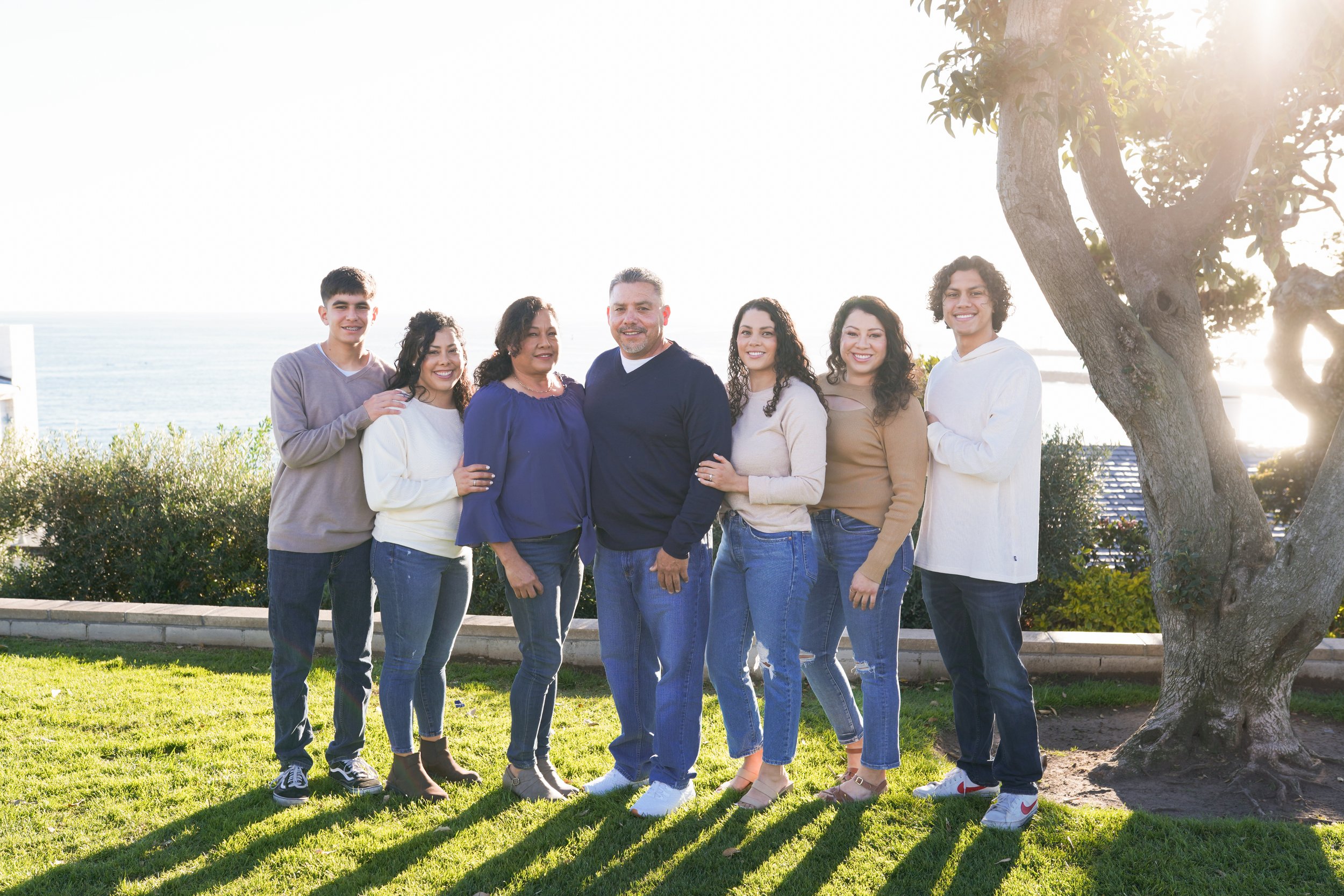 Golden hour family photos at Corona Del Mar—soft light, ocean views, and timeless coastal moments.