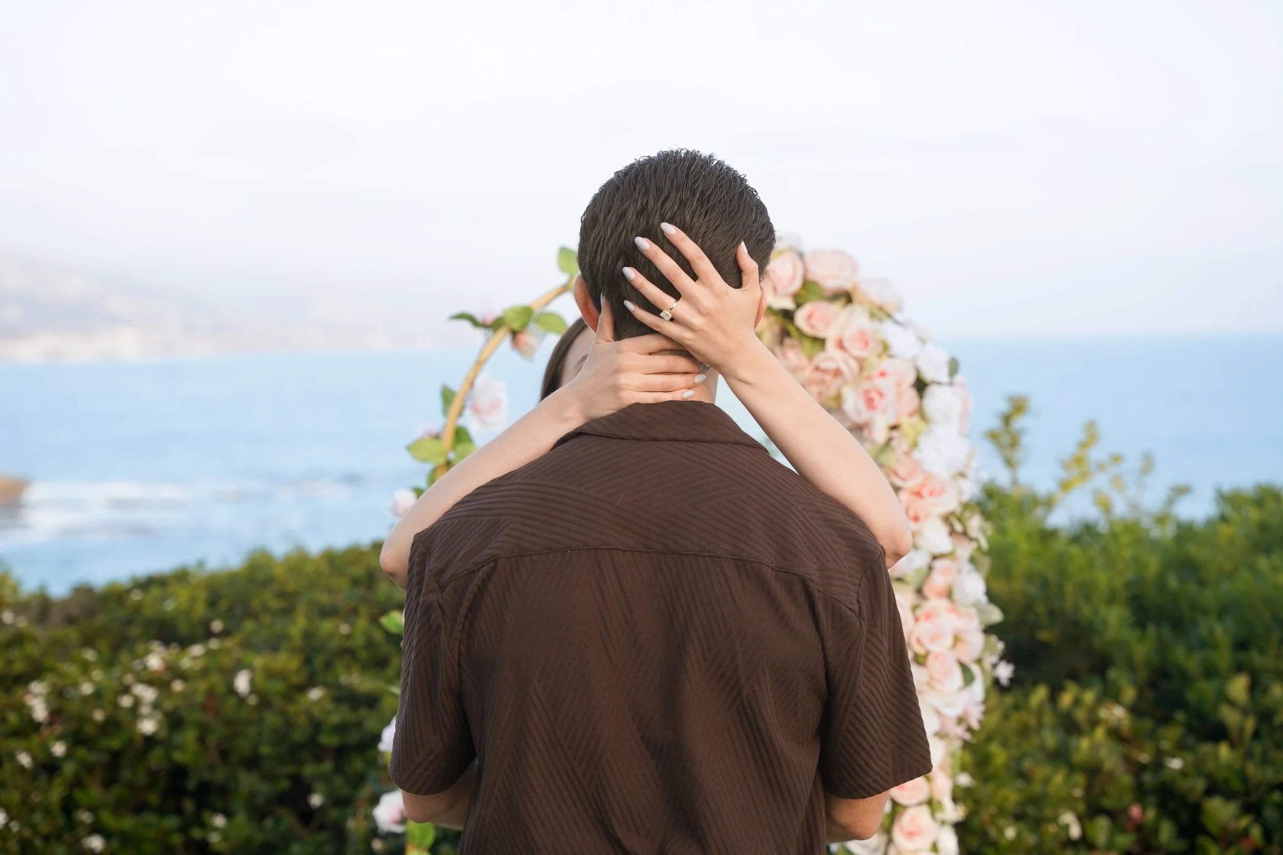 A Laguna Beach Surprise Proposal with a Romantic Floral Arch | Matt &amp; Jessica's Coastal Engagement Story