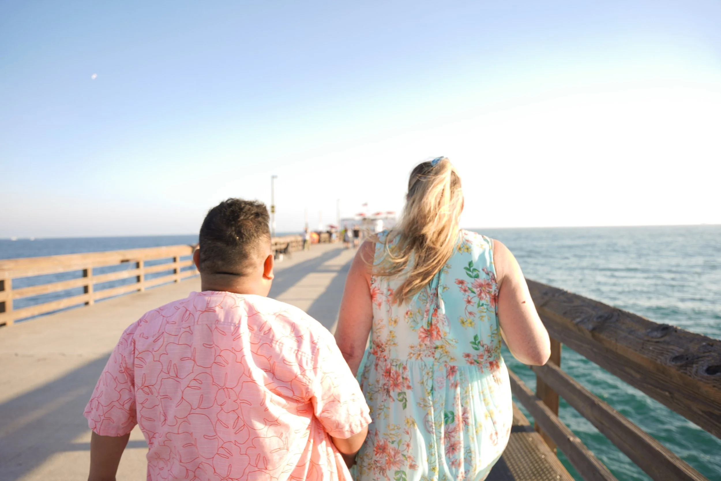 Romantic surprise engagement at Balboa Beach, Newport captured with our Orange County undercover proposal photography package.