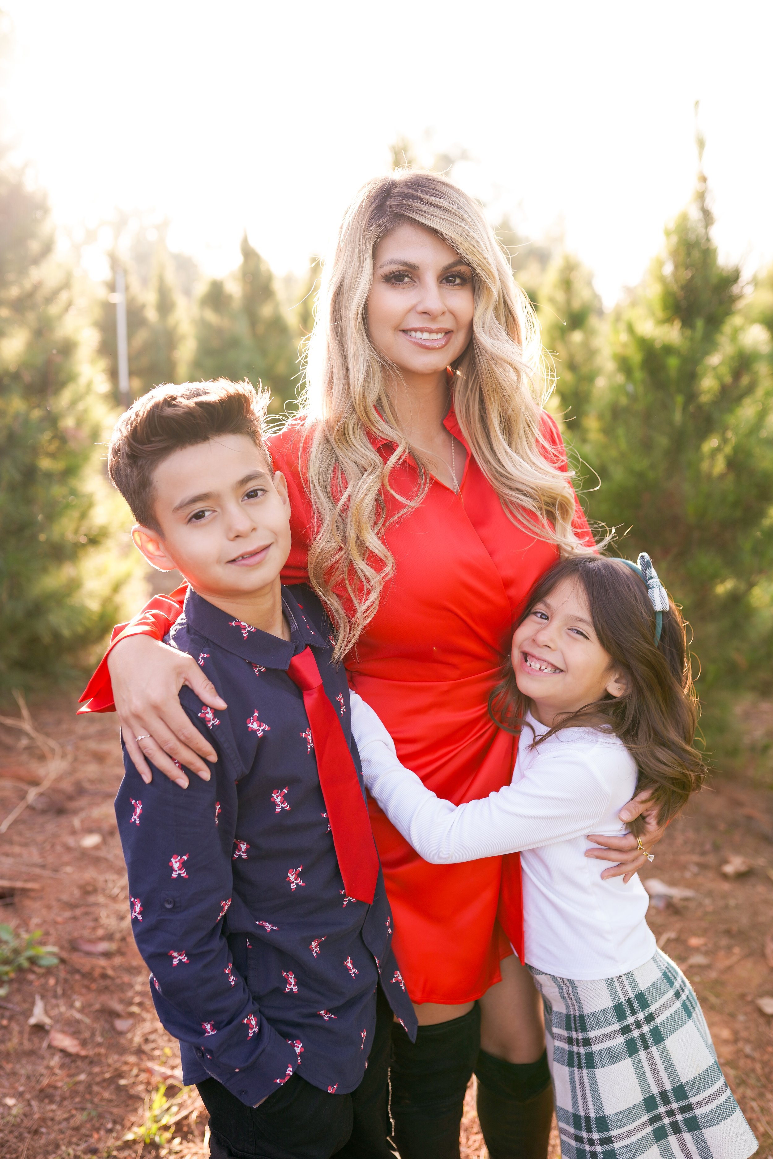 A cozy holiday session capturing a family's joy as they picked out their Christmas tree and placed the star on top. A beautiful moment of togetherness and new traditions—perfect for holiday family photography filled with warmth and cheer.