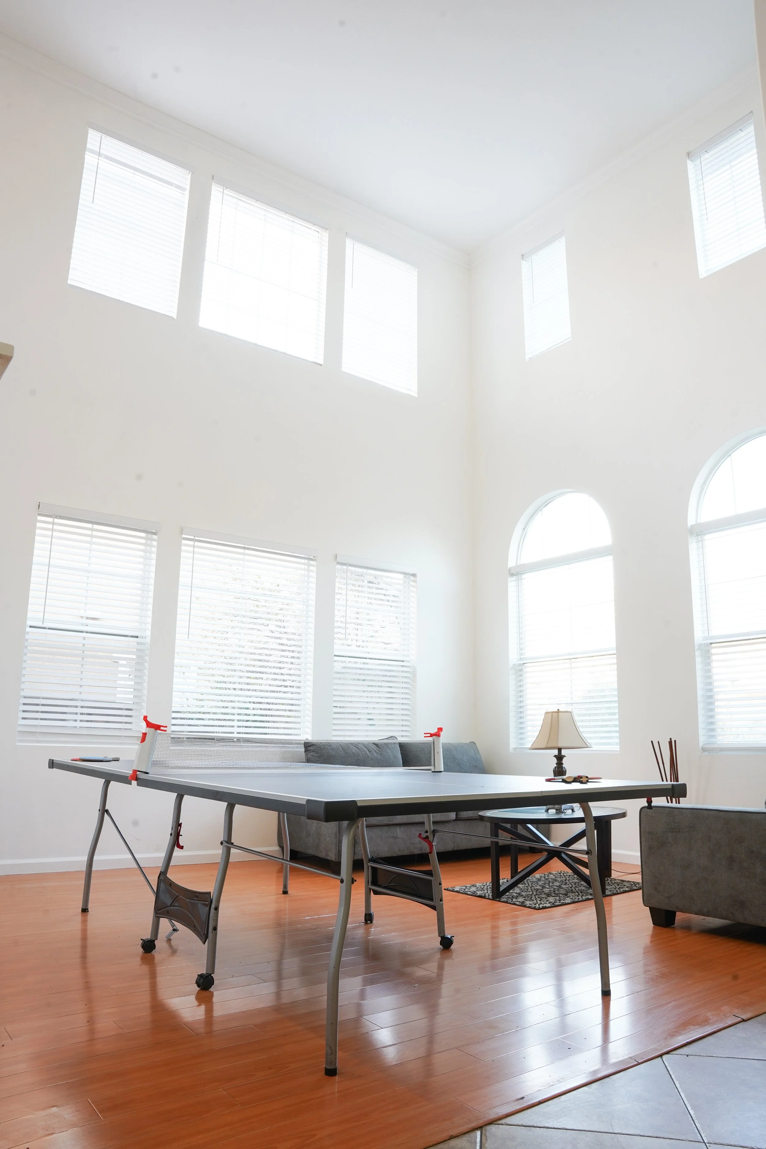 Professional photography highlighting a home game room with entertainment space.
