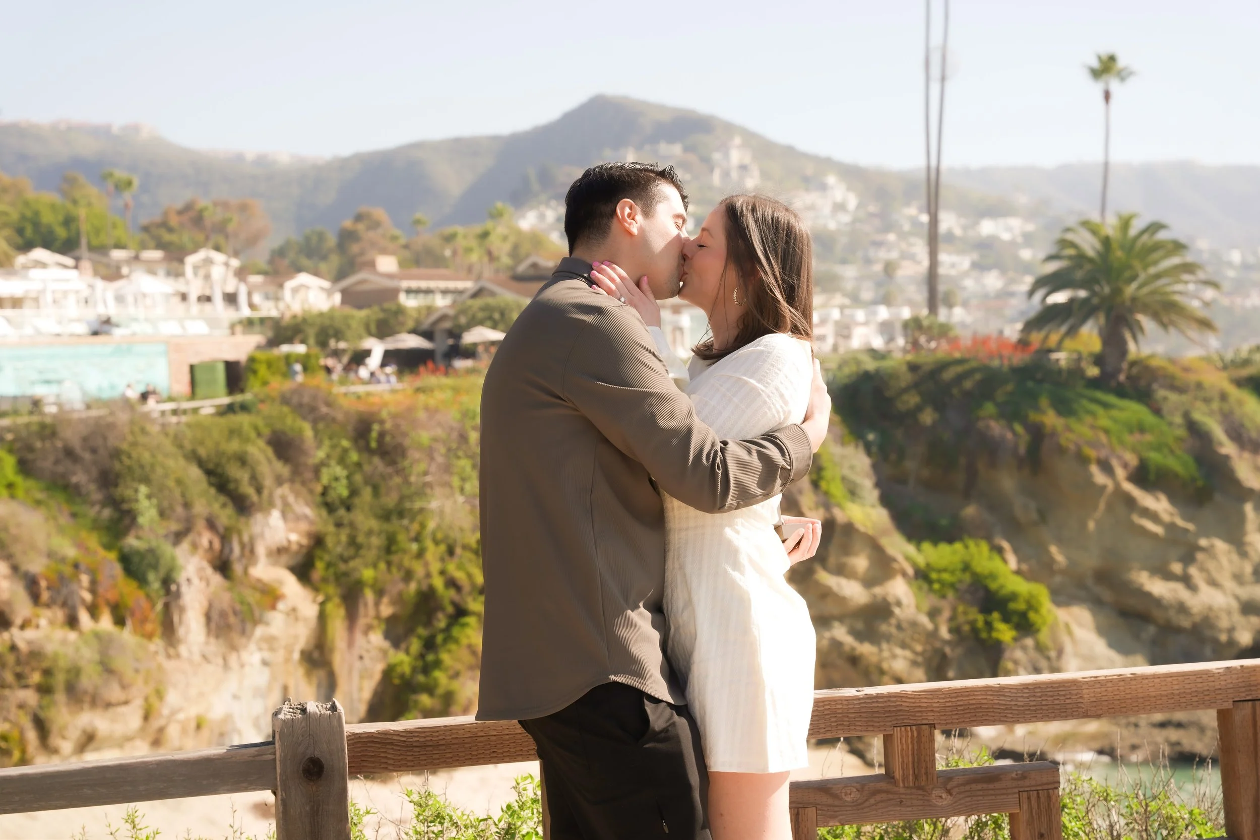 Surprise proposal photography in Laguna Beach at Montage Beach, documenting the exact moment love turned into forever.