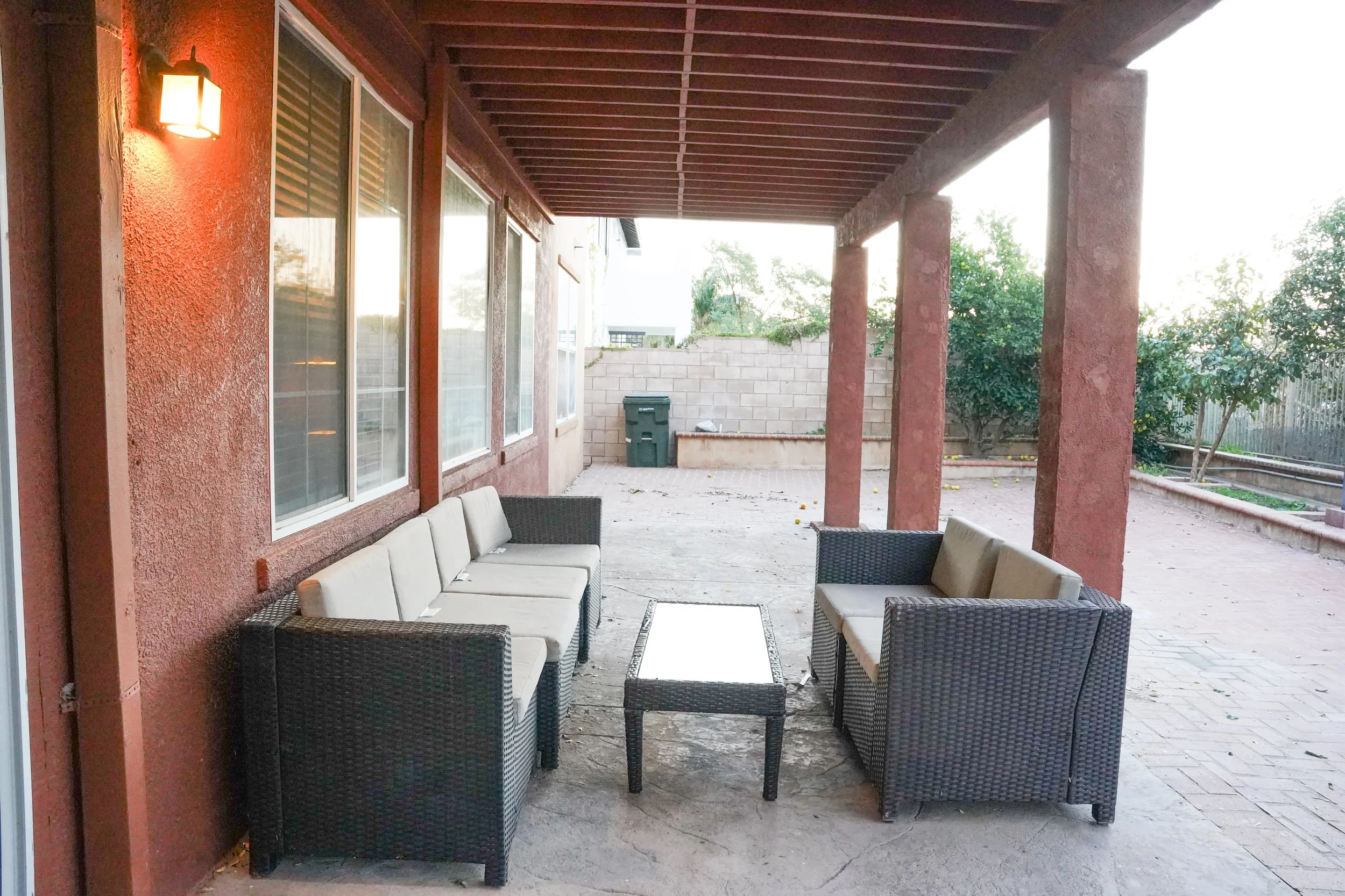 Real estate photography of spacious backyard designed for outdoor living and Airbnb guests.