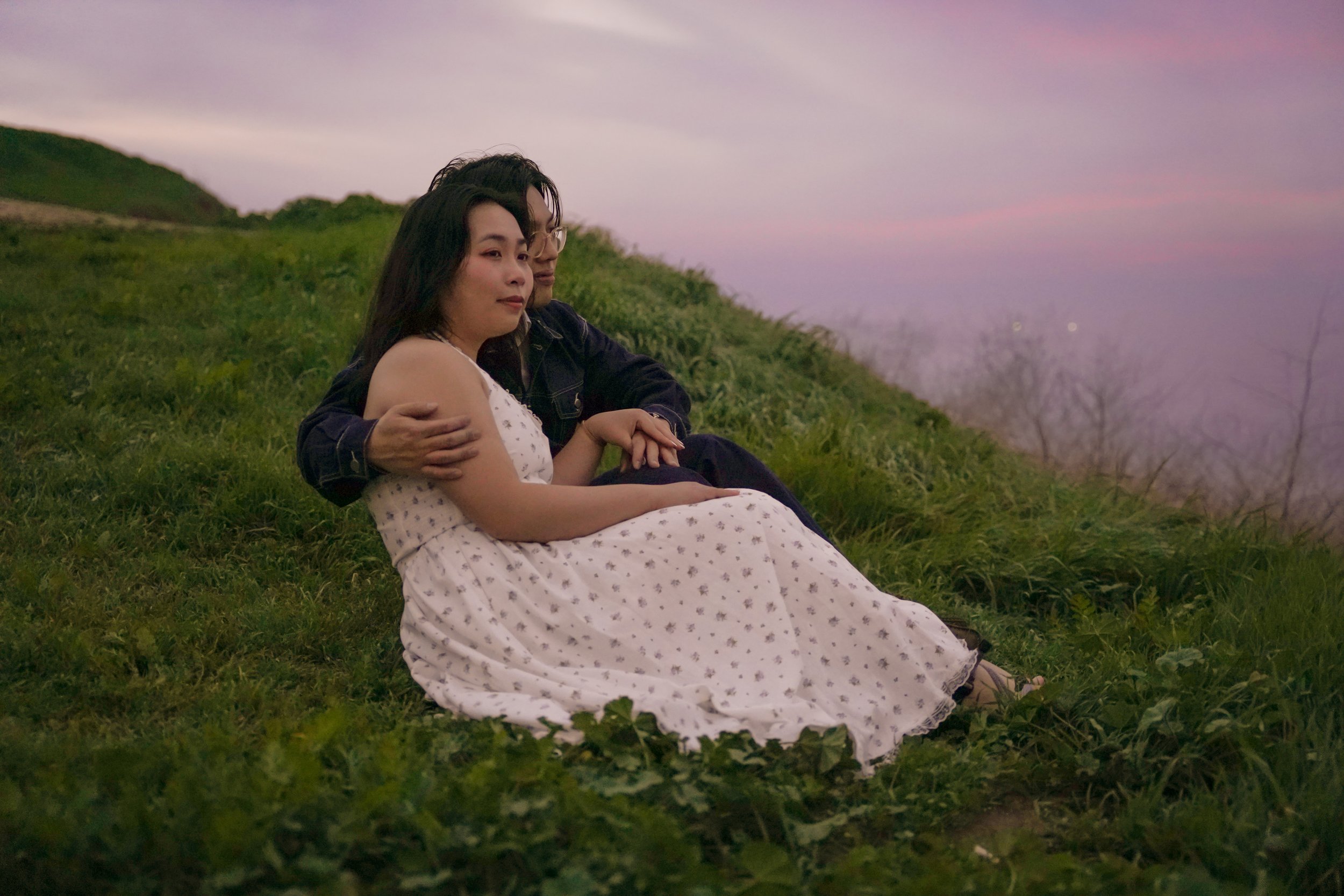 Surprise proposal overlooking the Palos Verdes Estates Bluff Trail cliffs during blue hour, with dramatic ocean views and soft coastal light.