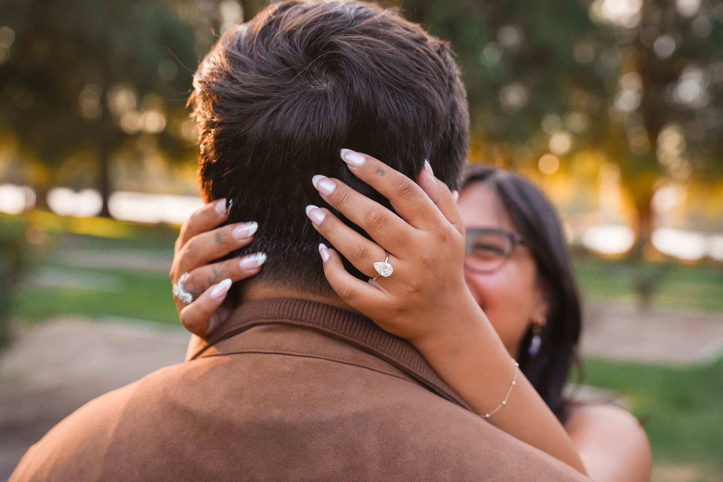 Couple celebrating their surprise proposal in Riverside, California.
