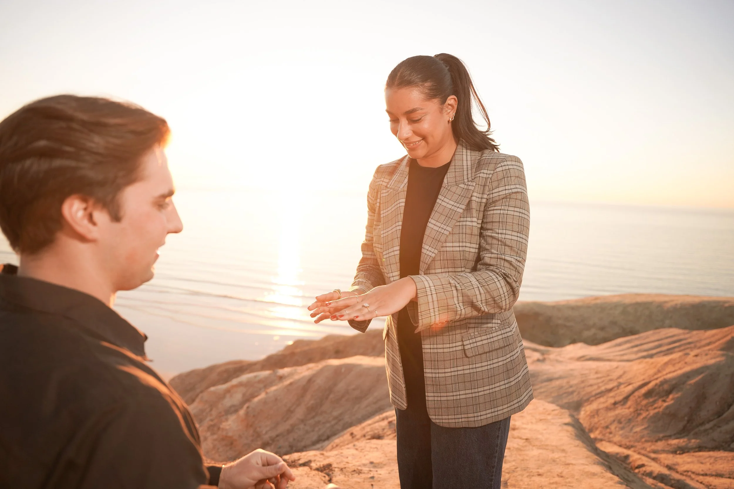 An emotional surprise proposal at La Jolla Gliderport, where high school sweethearts began their next chapter together.