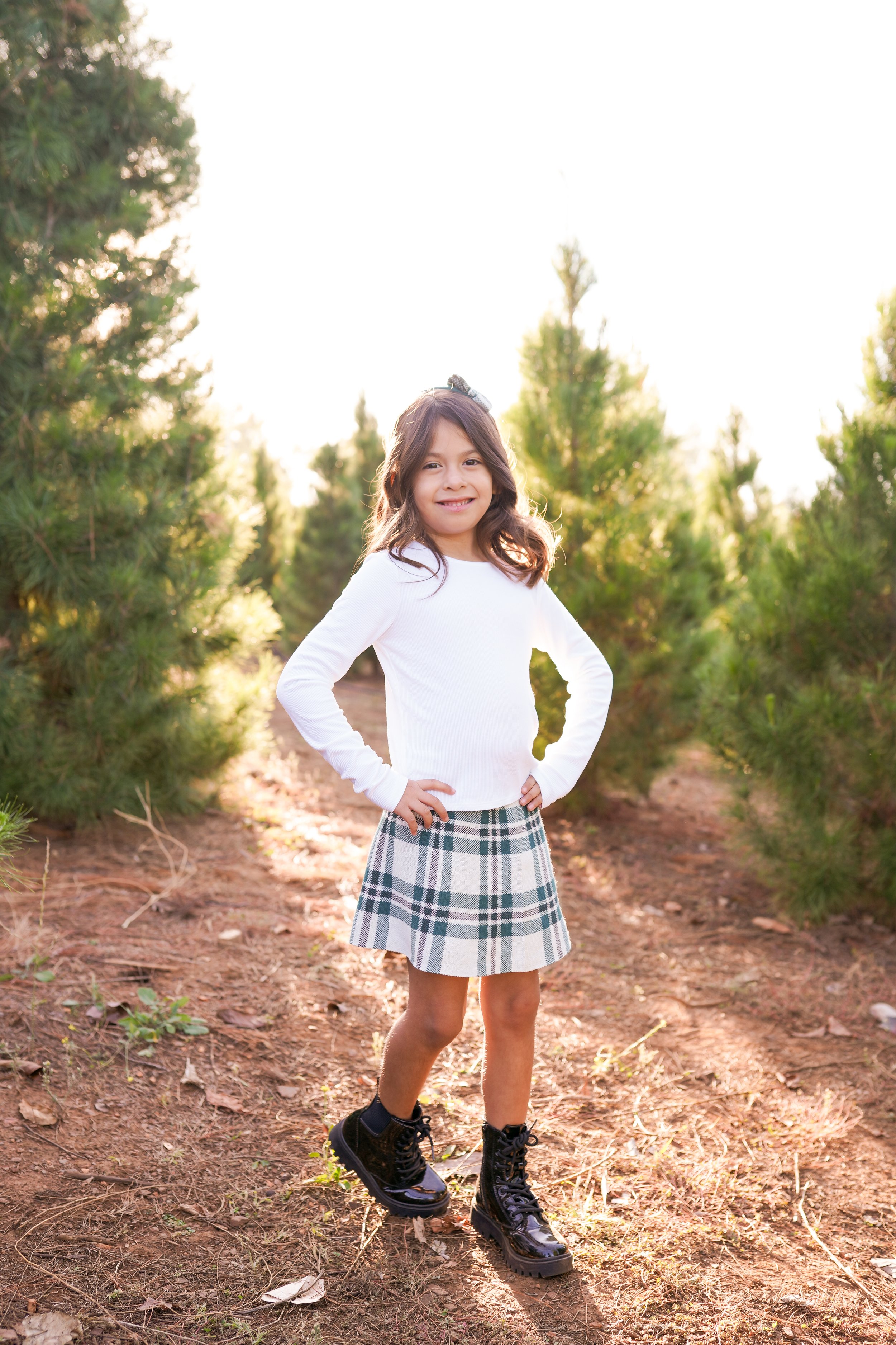 A cozy holiday session capturing a family's joy as they picked out their Christmas tree and placed the star on top. A beautiful moment of togetherness and new traditions—perfect for holiday family photography filled with warmth and cheer.
