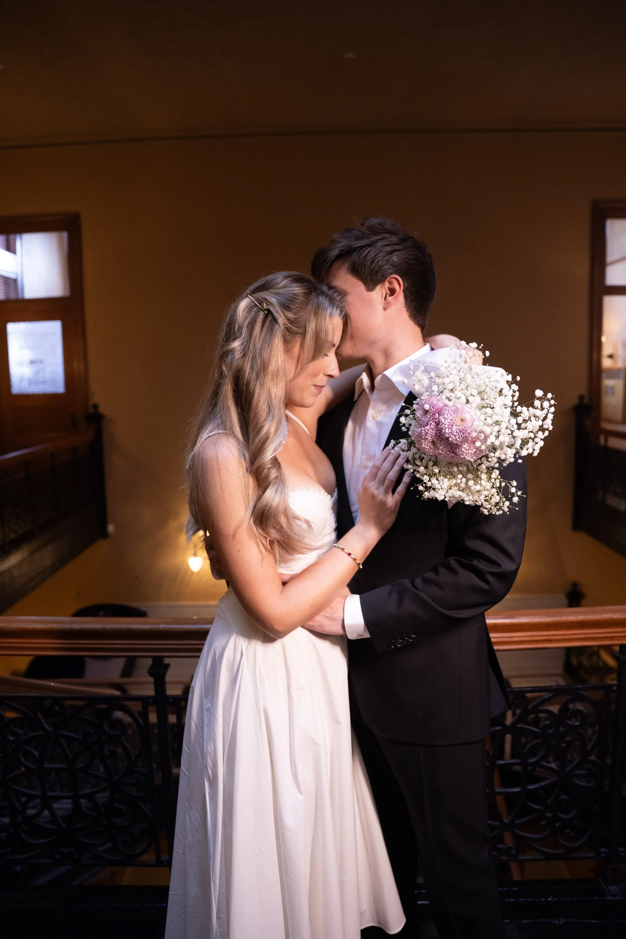 Bride and groom embracing after their civil ceremony at the historic Orange County Courthouse in Santa Ana, captured in timeless courthouse wedding photography.