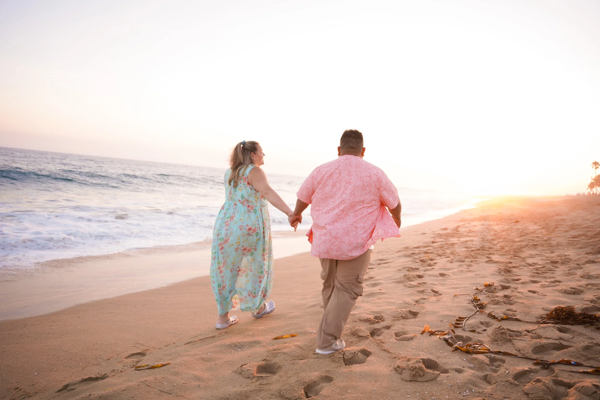 Newport Balboa Beach couple’s proposal shoot, surprise engagement captured with undercover Orange County package.