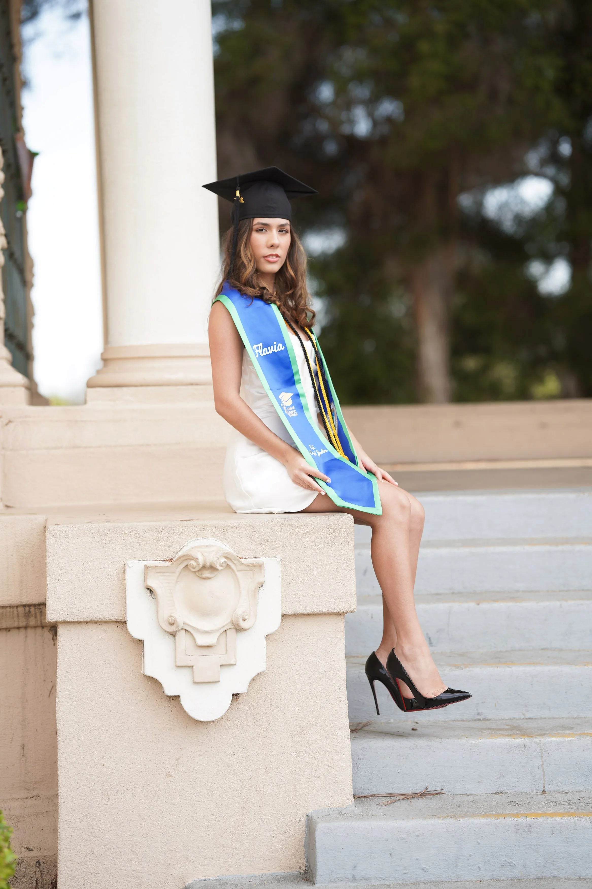 UWF cap toss and candid graduation portraits at San Diego’s Balboa Park, captured with our milestone package.