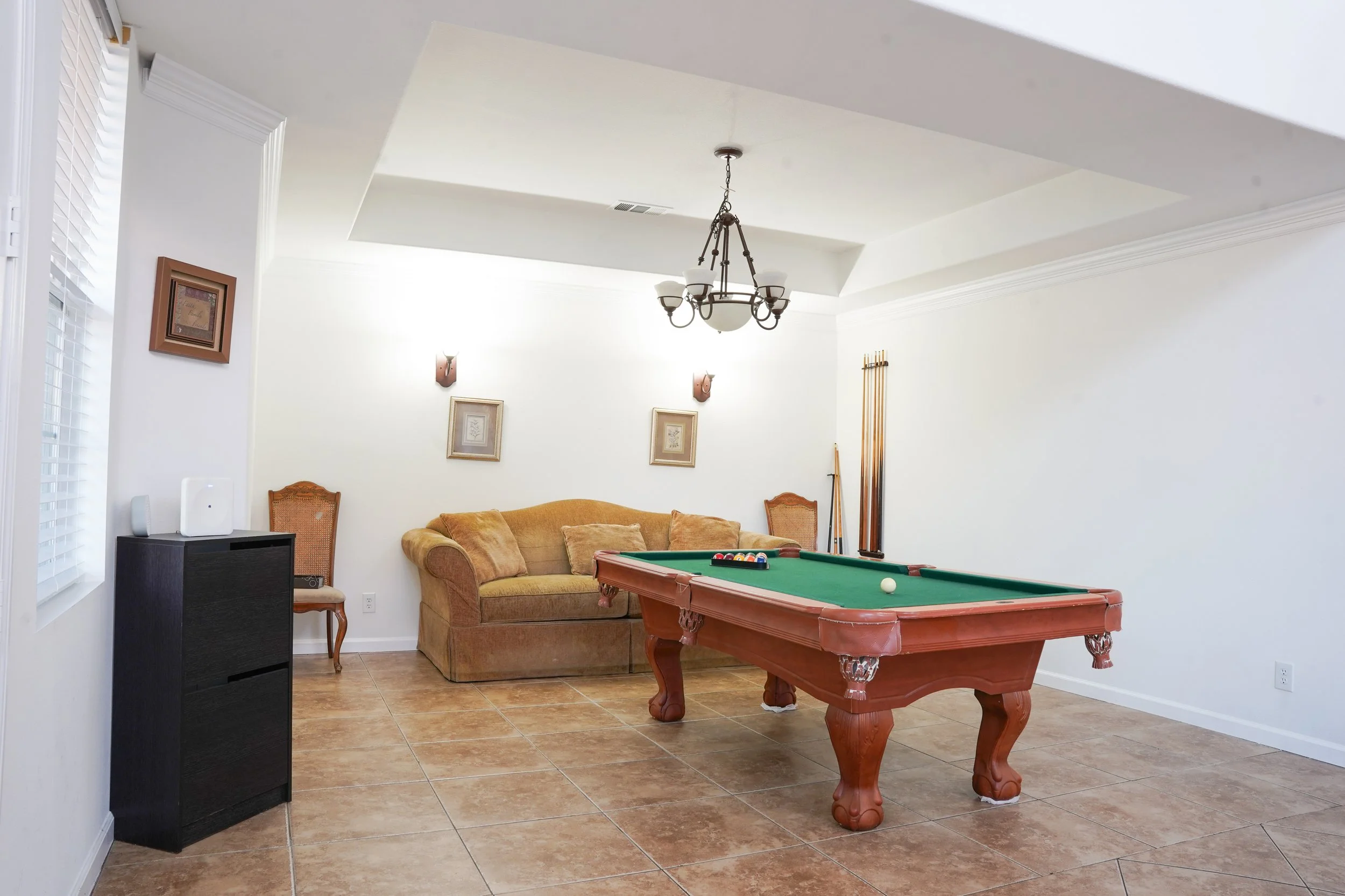 Wide-angle property photo showcasing spacious living room design.