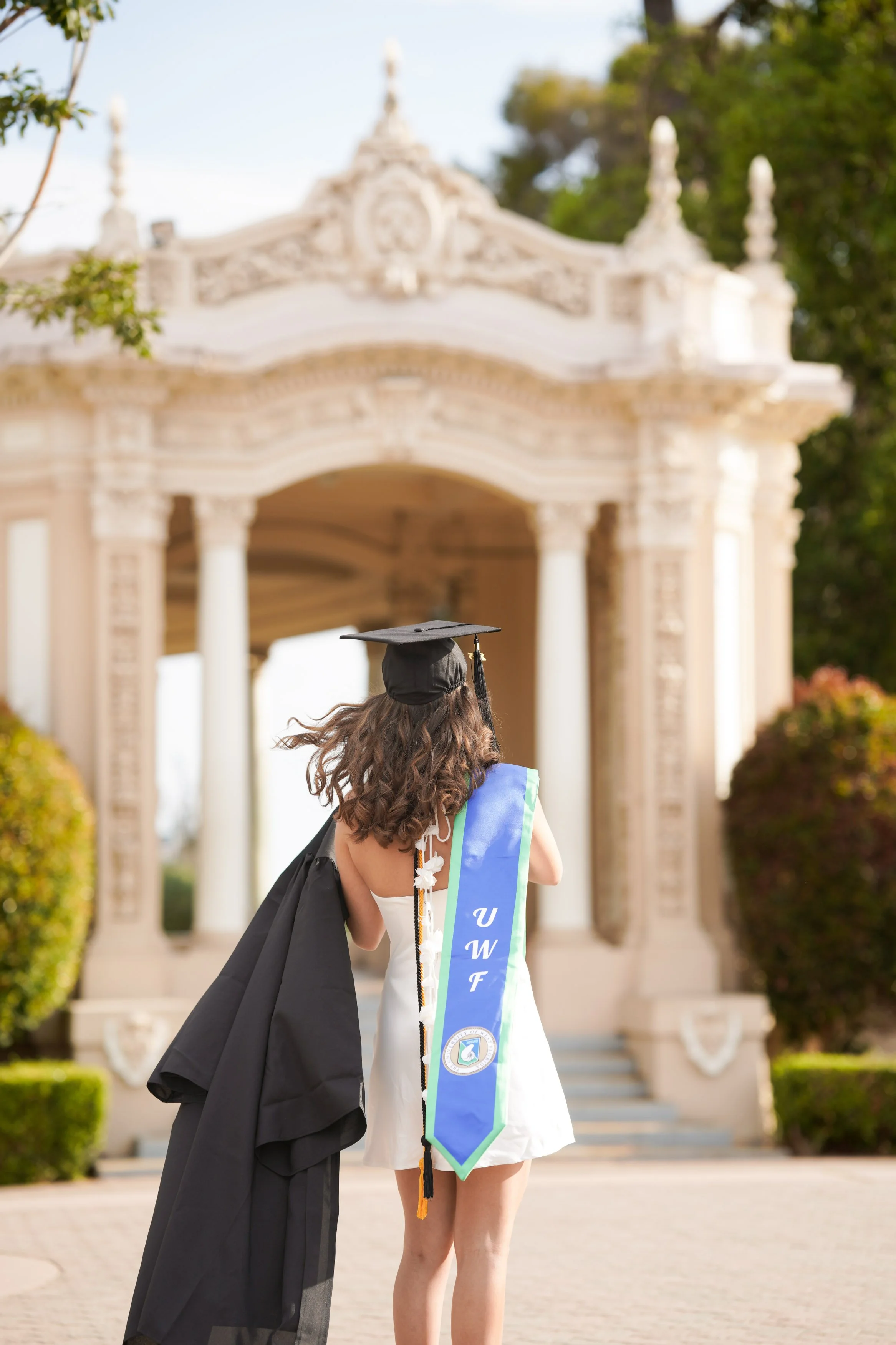 A milestone UWF graduation session set in San Diego’s Balboa Park, blending travel and timeless photography.