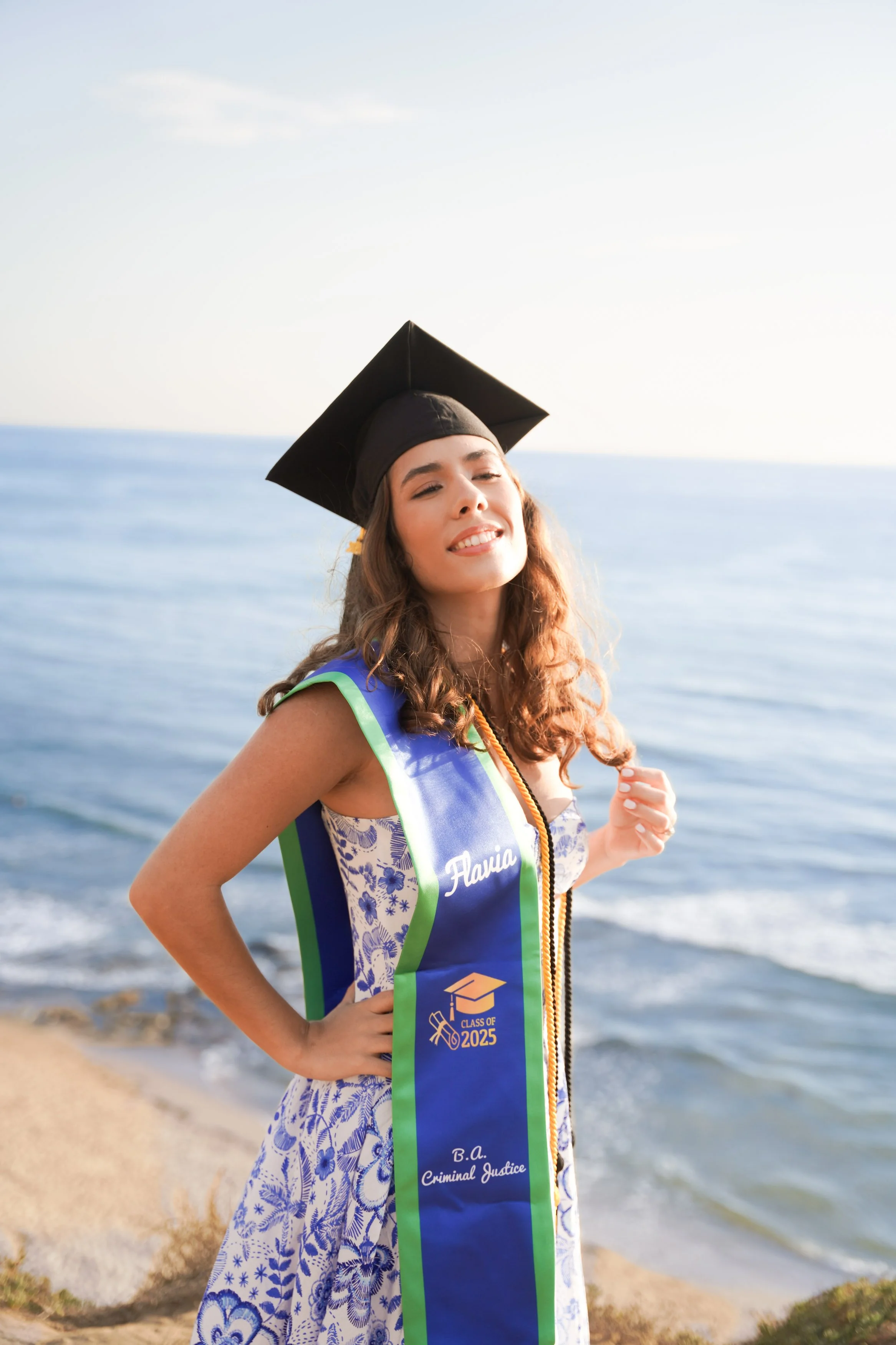 Golden hour graduation photography at Sunset Cliffs in San Diego, captured by a professional milestone photographer who specializes in timeless cap and gown portraits along the coast.