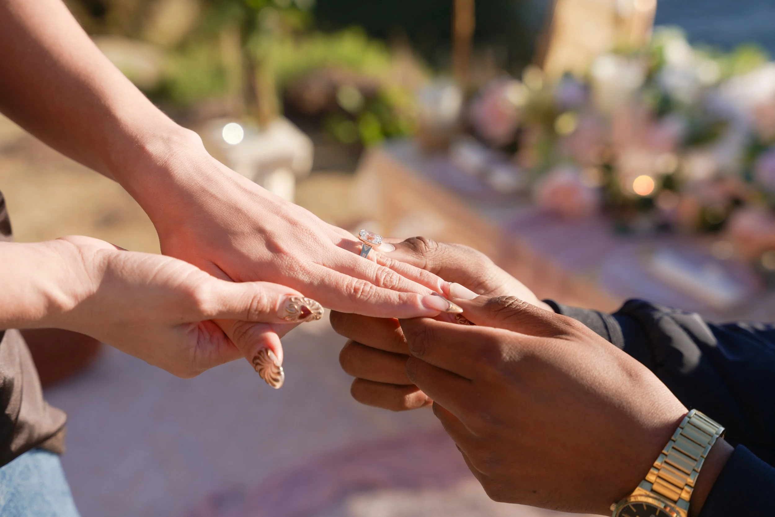 Cliffside boho surprise proposal at Sunset Cliffs, featuring an oceanfront picnic setup and professional proposal photography during golden hour.