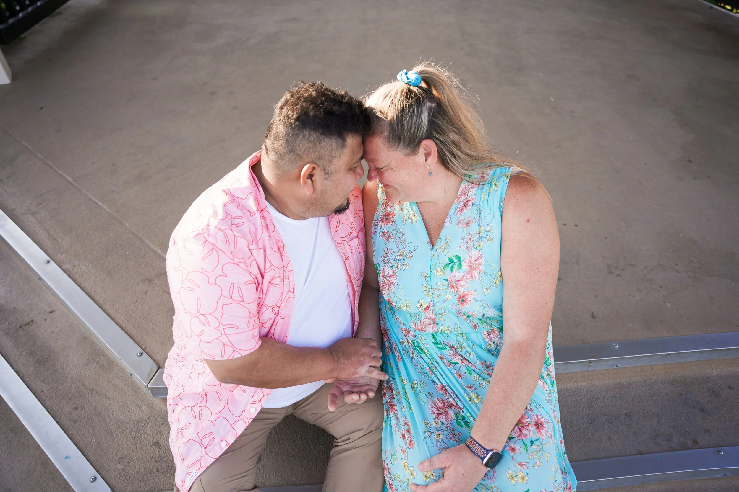 Surprise proposal at Balboa Pier in Newport Beach as Miguel gets on one knee, captured with our undercover Orange County engagement package.