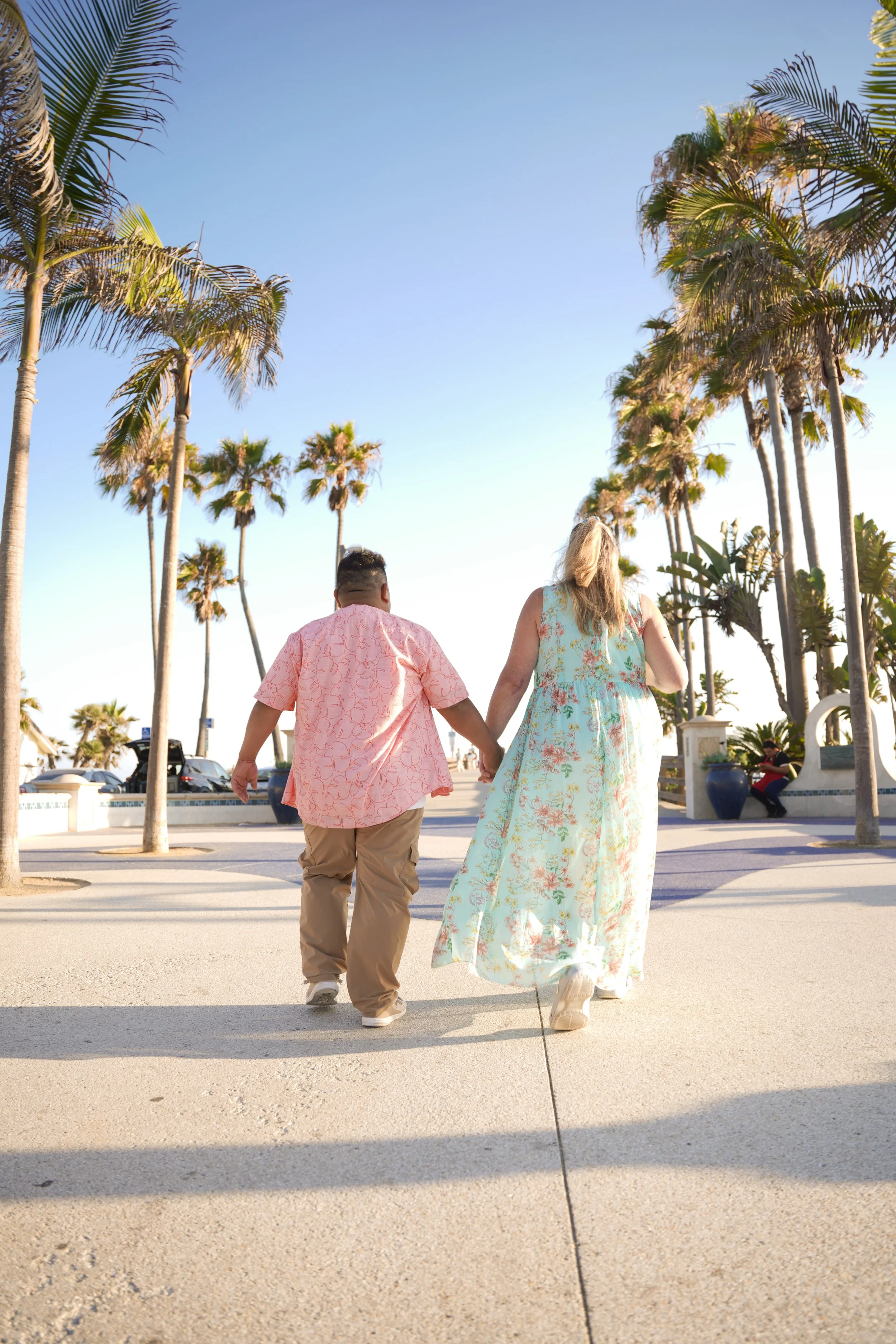 Newport Beach engagement photography of Miguel proposing to Jennifer on Balboa Pier, a romantic Orange County surprise proposal at sunset.
