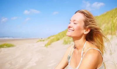 Woman on beach, low Vitamin D levels