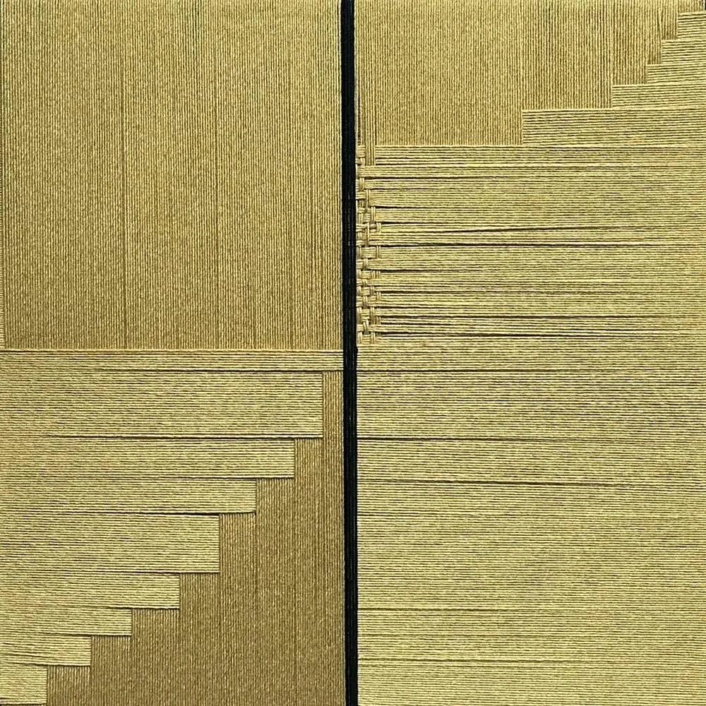 Gold bamboo threads wrap around a frame to create a descending and ascending grid. A band of black threads run vertically through the center..
