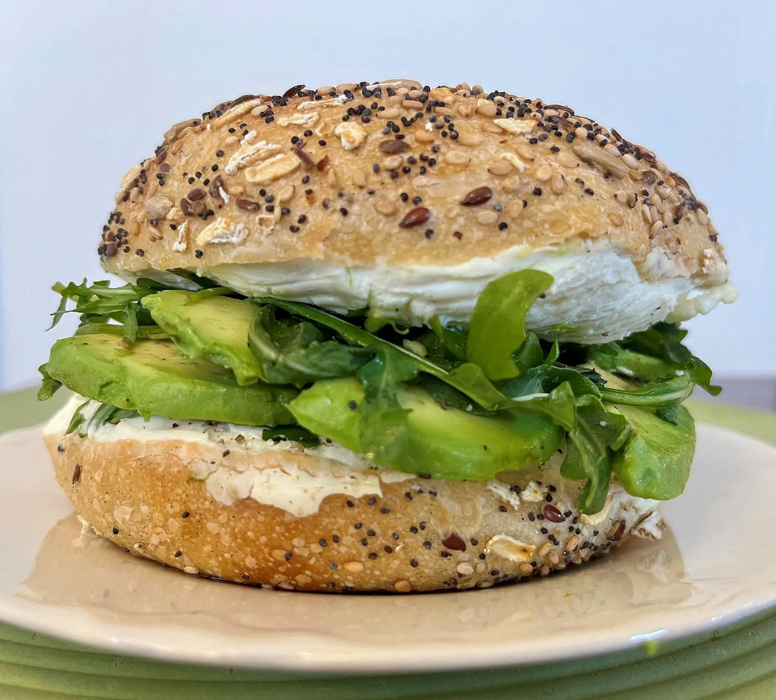 West Coast Breakfast bagel sandwich with avocado and arugula
