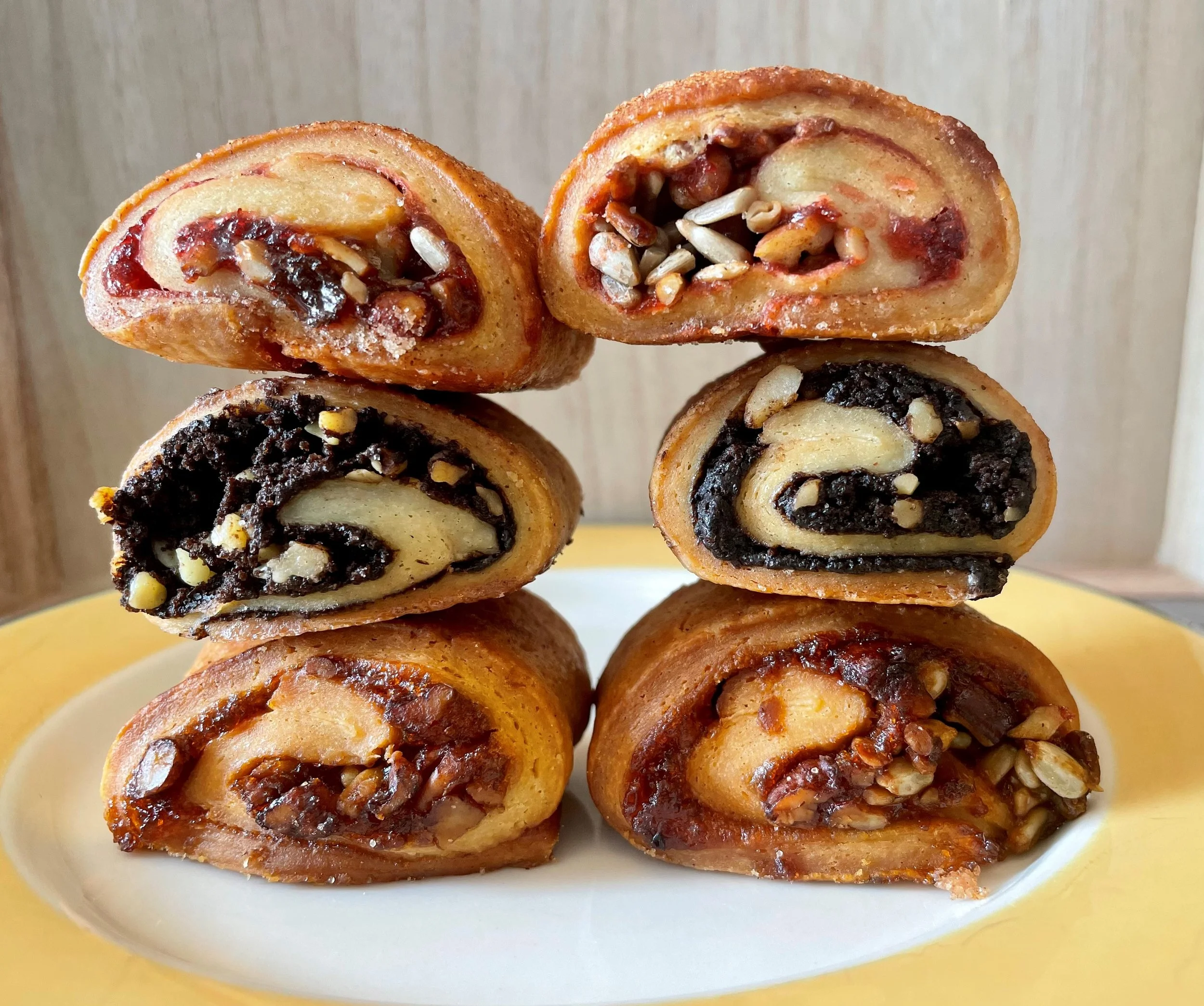 stacks of raspberry rugelach, chcolate rugelach and apricot rugelach
