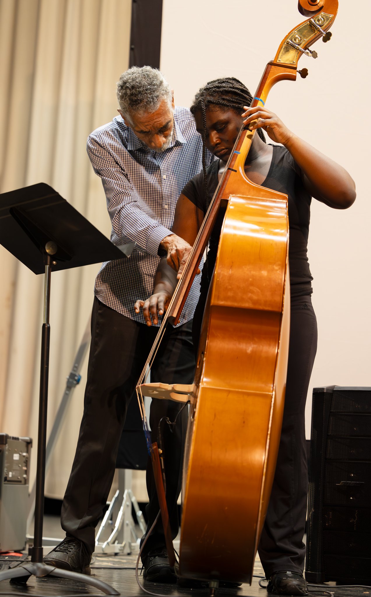 Historical black and white photo of Jazz legend, Lee Morgan, playing on stage with other musicians.