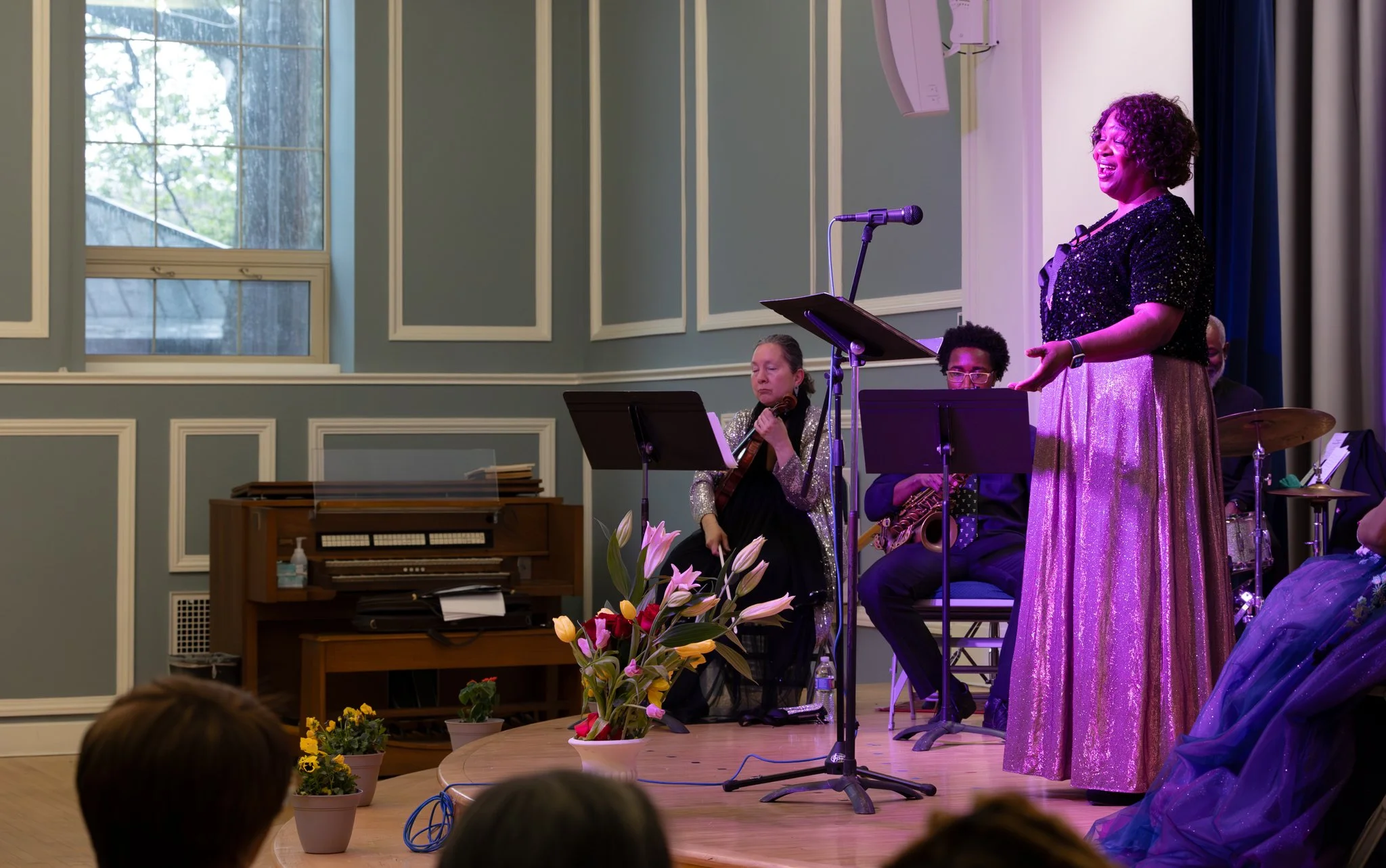 Young students learning about rhythm from a music teacher.