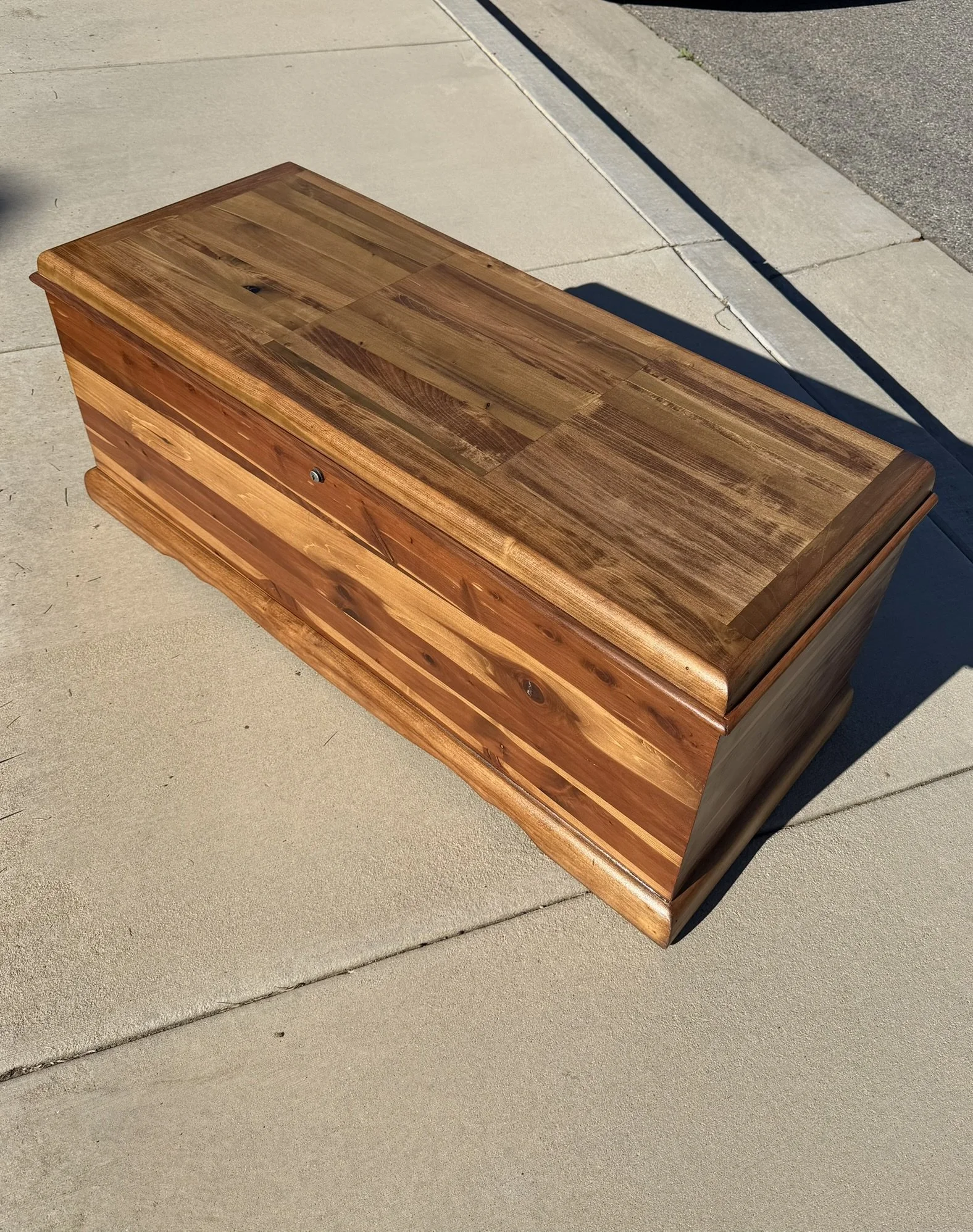 Side Profile View of Finished Chest - 

The client-chosen “Special Walnut” stain enhances the rich grain and variation of the cedar exterior.  A warm, timeless look.  No paint, just wood doing what it does best.