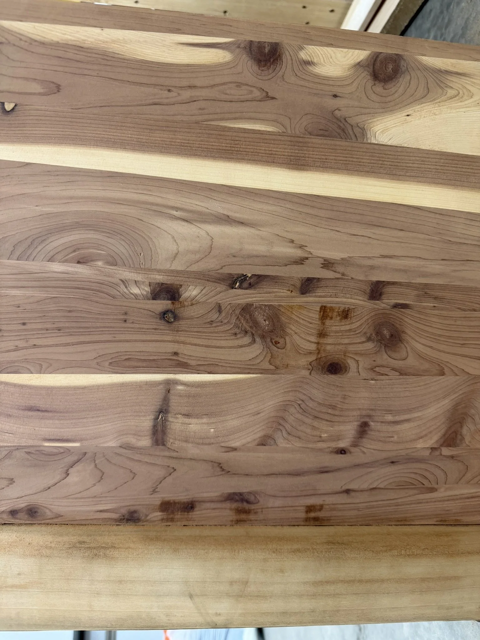 Close-up of Side Panel - 

Just look at that gorgeous cedar grain starting to shine through!  This close-up shows where the old veneer has been fully removed.  Underneath, the solid cedar panels are finally able to breathe again, and they’re stunning