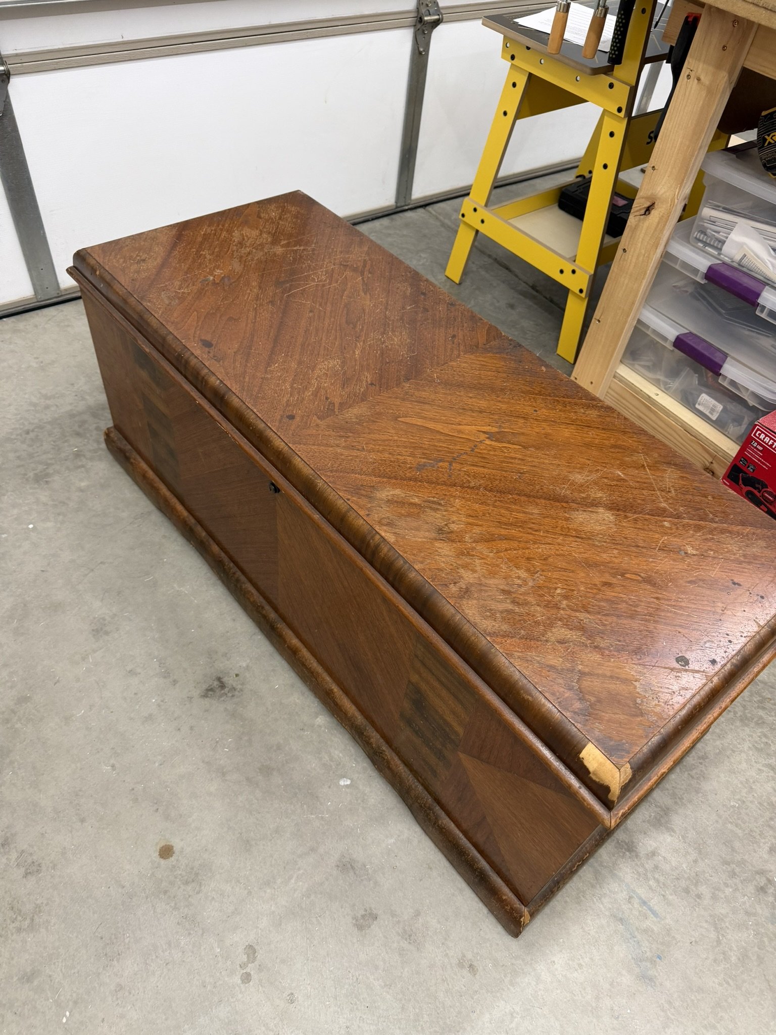 The 1951 Lane Cedar Chest: Before Restoration -  

This chest has seen decades of use, and it shows.  The once-stunning top now bears deep scratches, wear patterns, and peeling veneer.  Beneath the damage lies solid craftsmanship from Lane - a compan