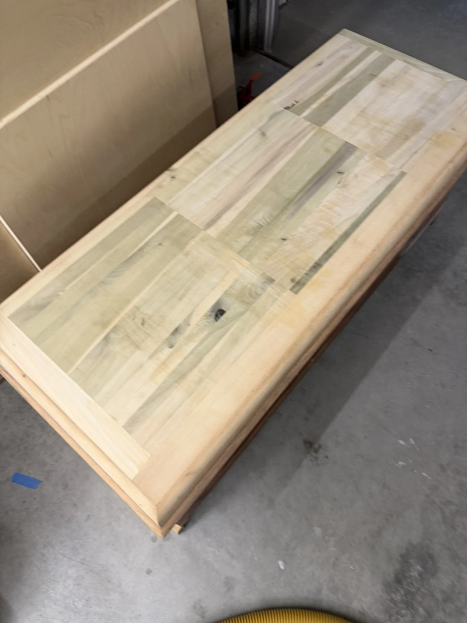 Top Panel Revealed: Solid Poplar - 

With all veneer carefully removed, the lid reveals its true character: solid poplar, known for its subtle green and cream hues.  The distinctive coloration and grain pattern make poplar easily identifiable.  Care 