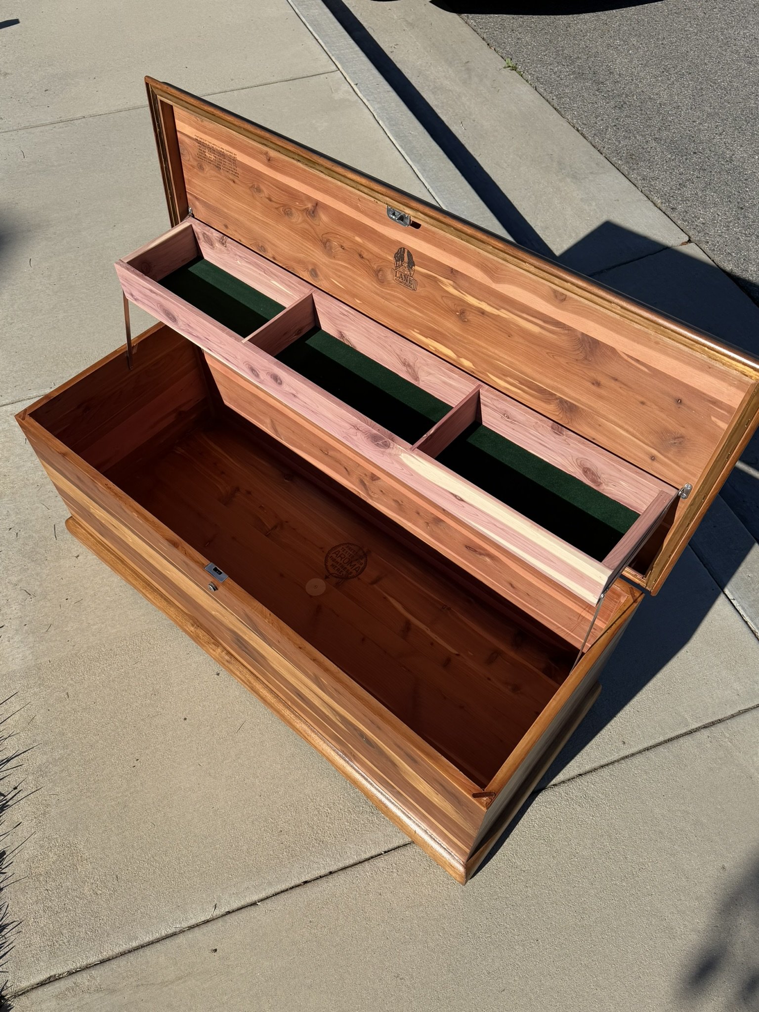 Interior Rebuilt, Vintage Soul Preserved - 

The inside tray was rebuilt with fresh cedar to match the original layout.  Lane's branding and the original cedar paneling were preserved, cleaned, and refreshed.  The green felt lining was custom-fit to 