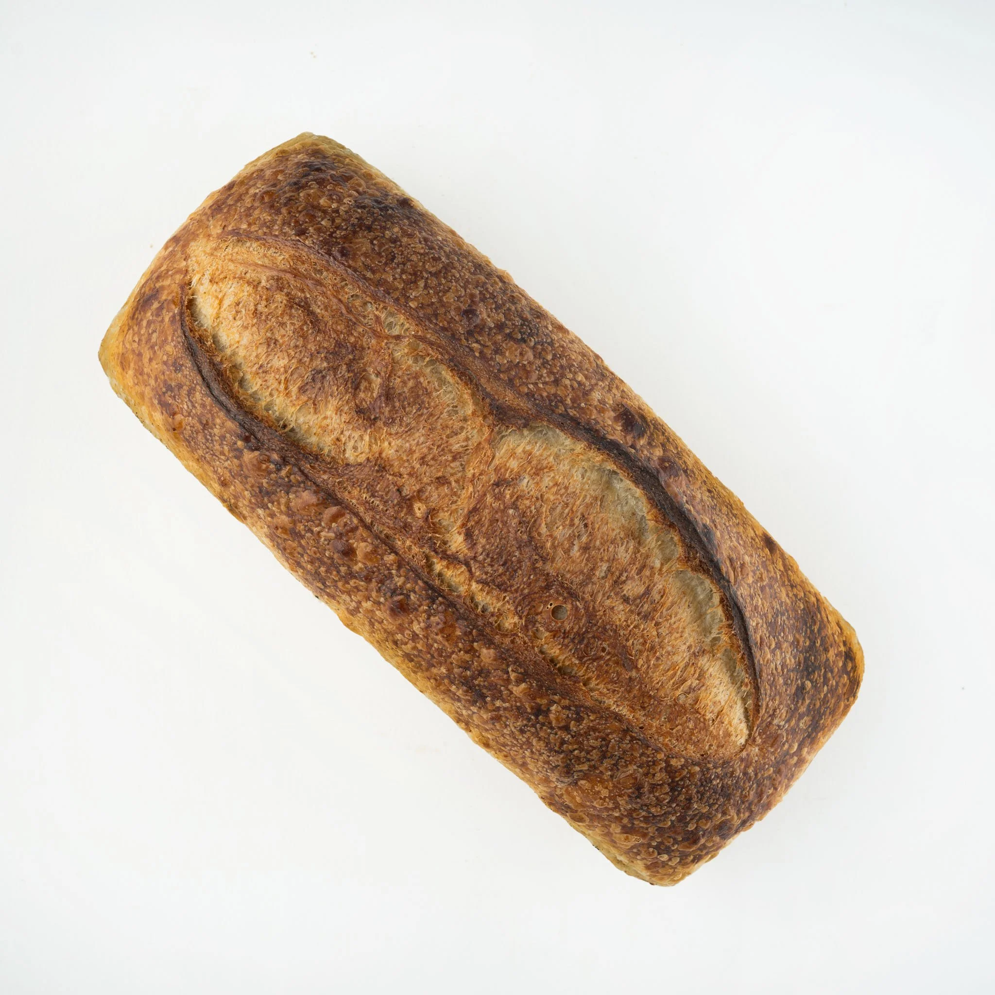 COUNTRY WHITE PAN LOAF
Our classic country white sourdough baked in a pan loaf for perfect sandwich slices. Made with 80% organic white wheat, and 20% organic whole Emmer