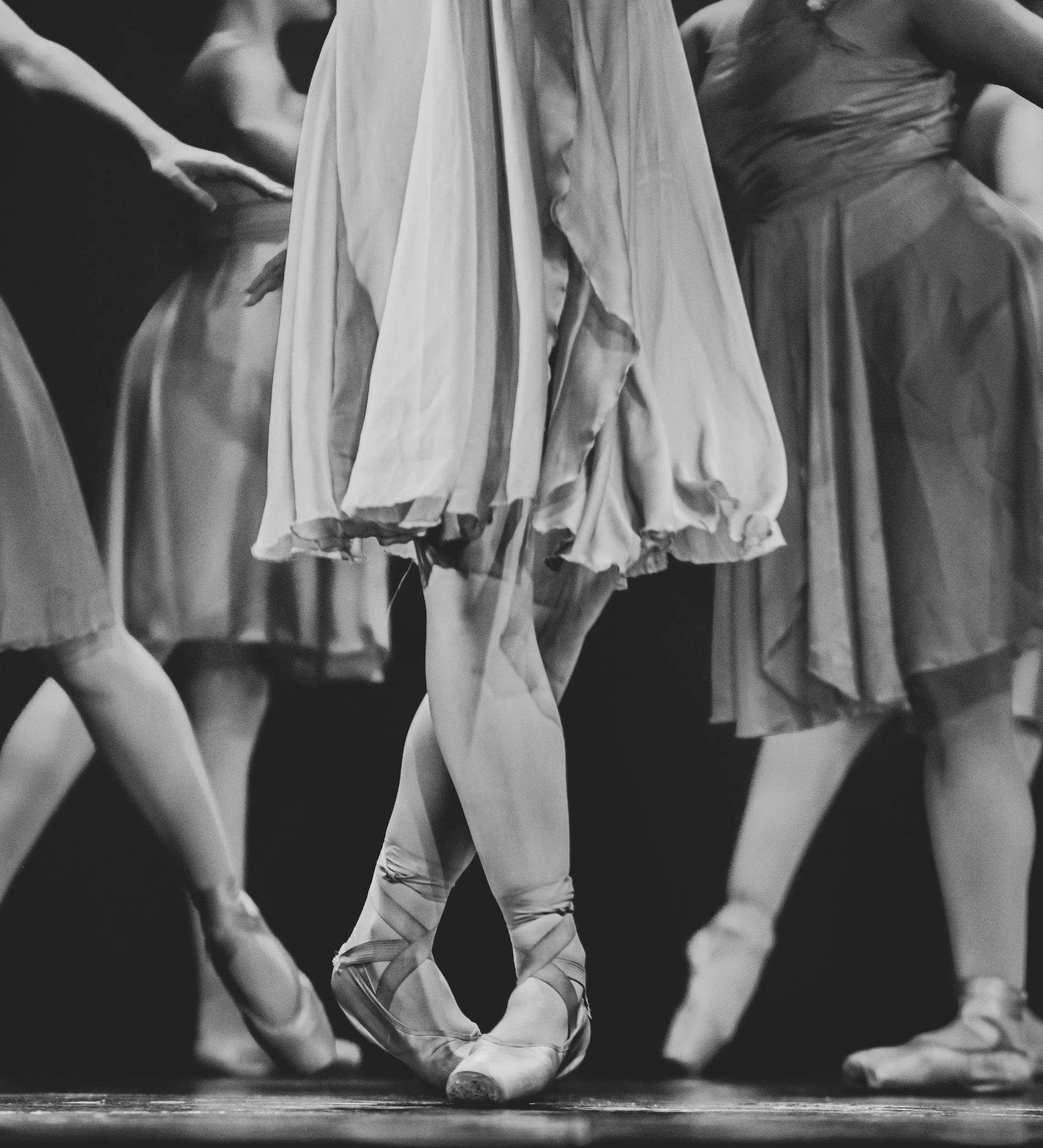 Adult ballet dancers in pointe shoes