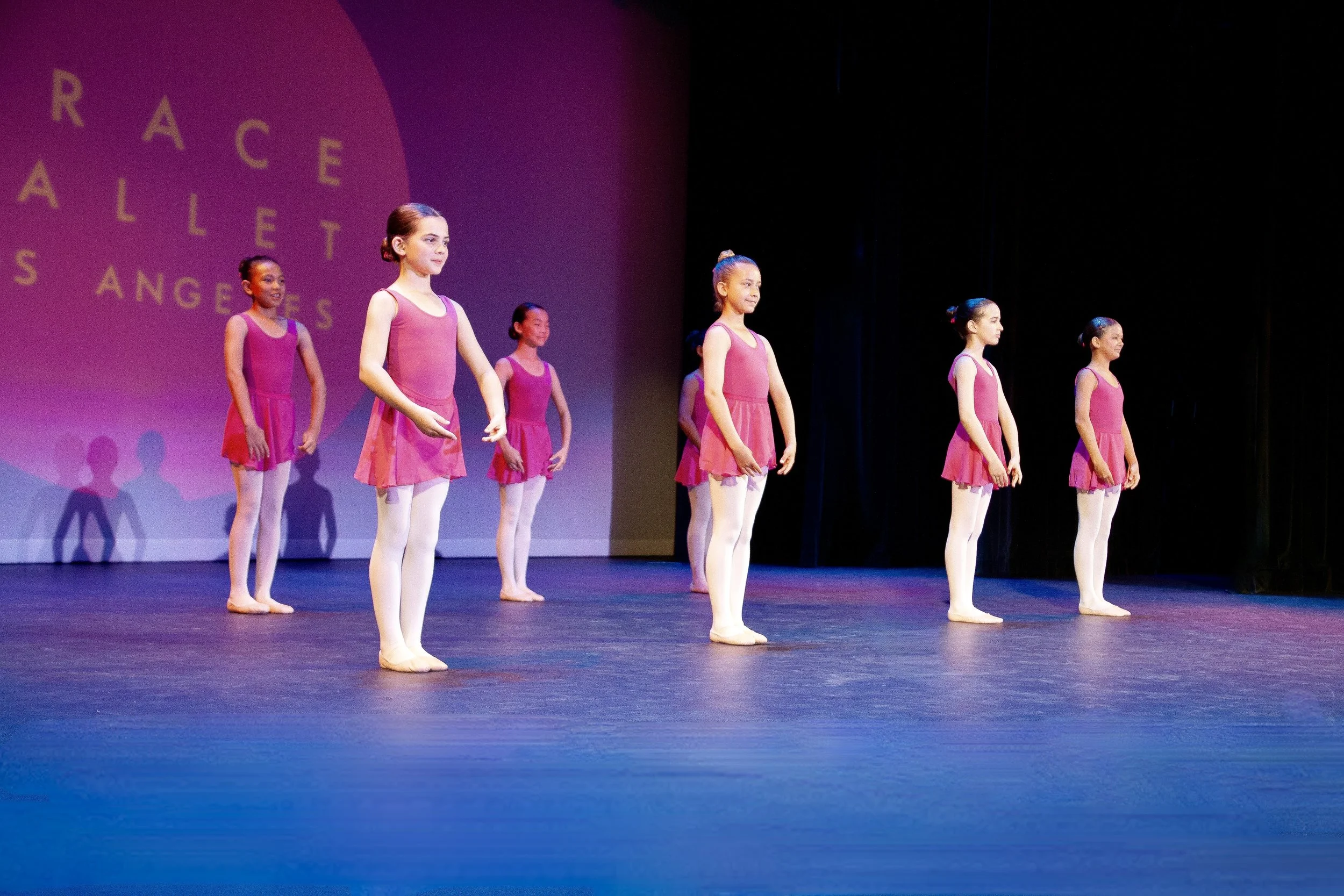 Ballet dancers in pink on stage at the Grace Ballet gala