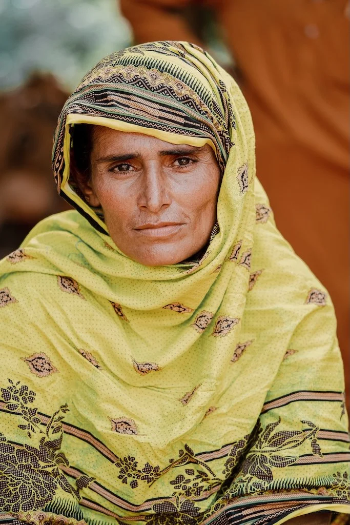 A Pakistani woman involved in ACE Cotton looking at the camera