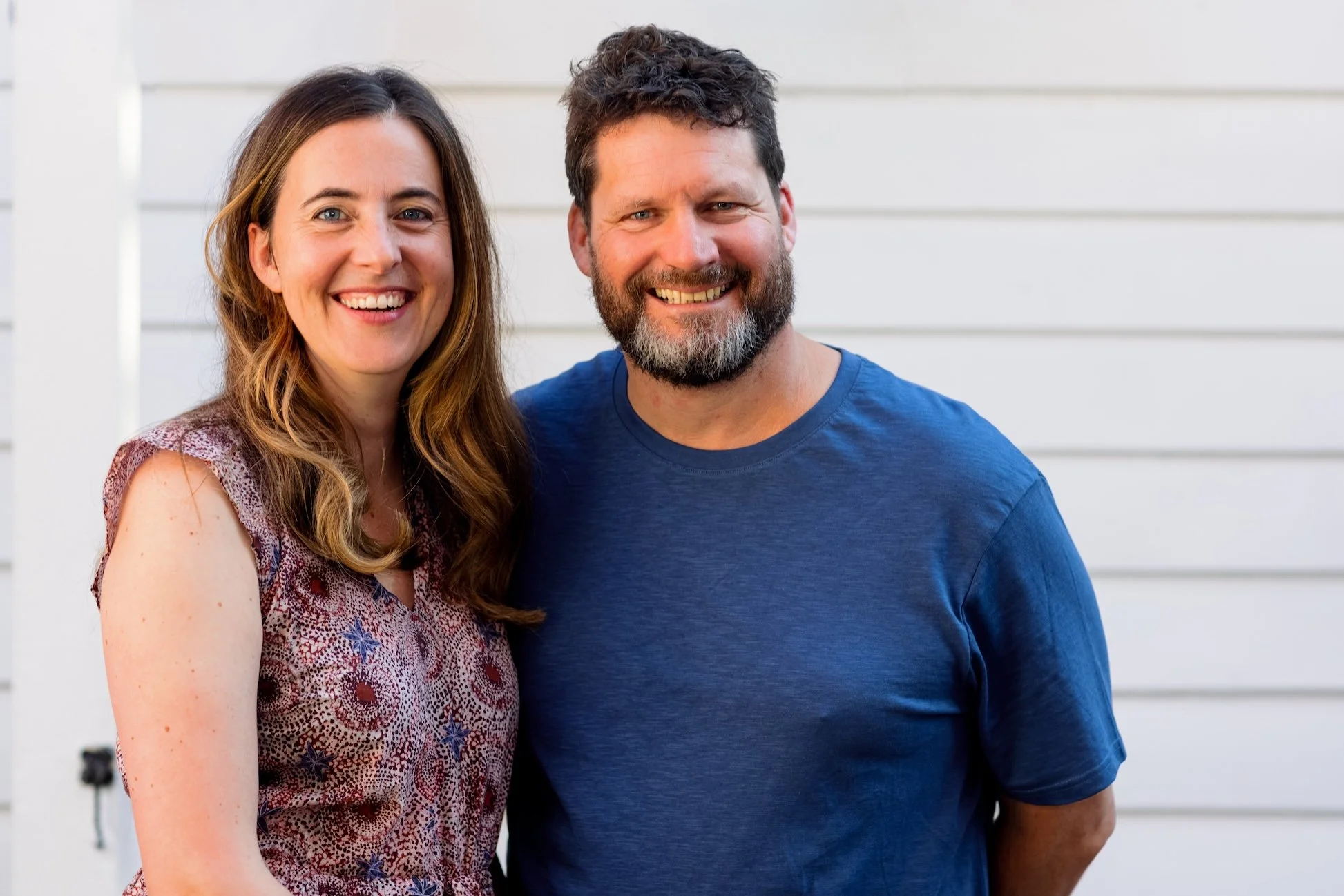 Pilio founders Catherine and Russell embracing and smiling
