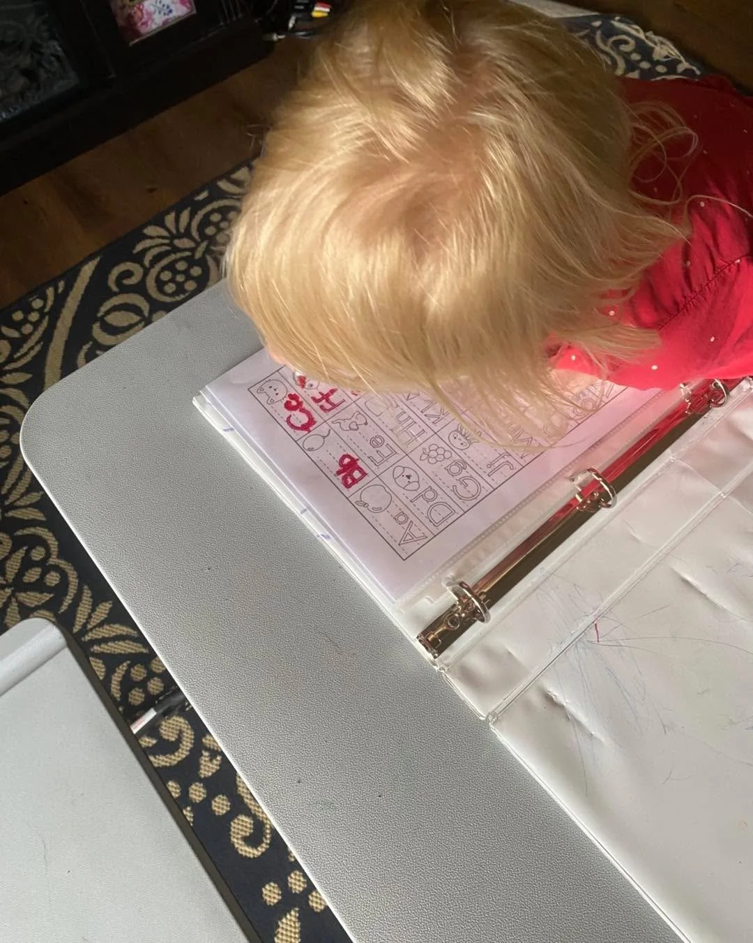 Homeschool success of the day: a worksheet inside a sheet protector, a whiteboard marker, and suddenly it is reusable and much more exciting. 😂

She can practice it again without printing another page, and apparently writing with a marker makes ever