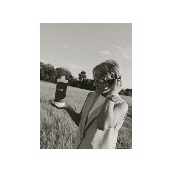 A gif of Holly Taylor, an entrepreneur from Alabama, showing off her brand photos for The Salty Spray, her mobile spray tan business.