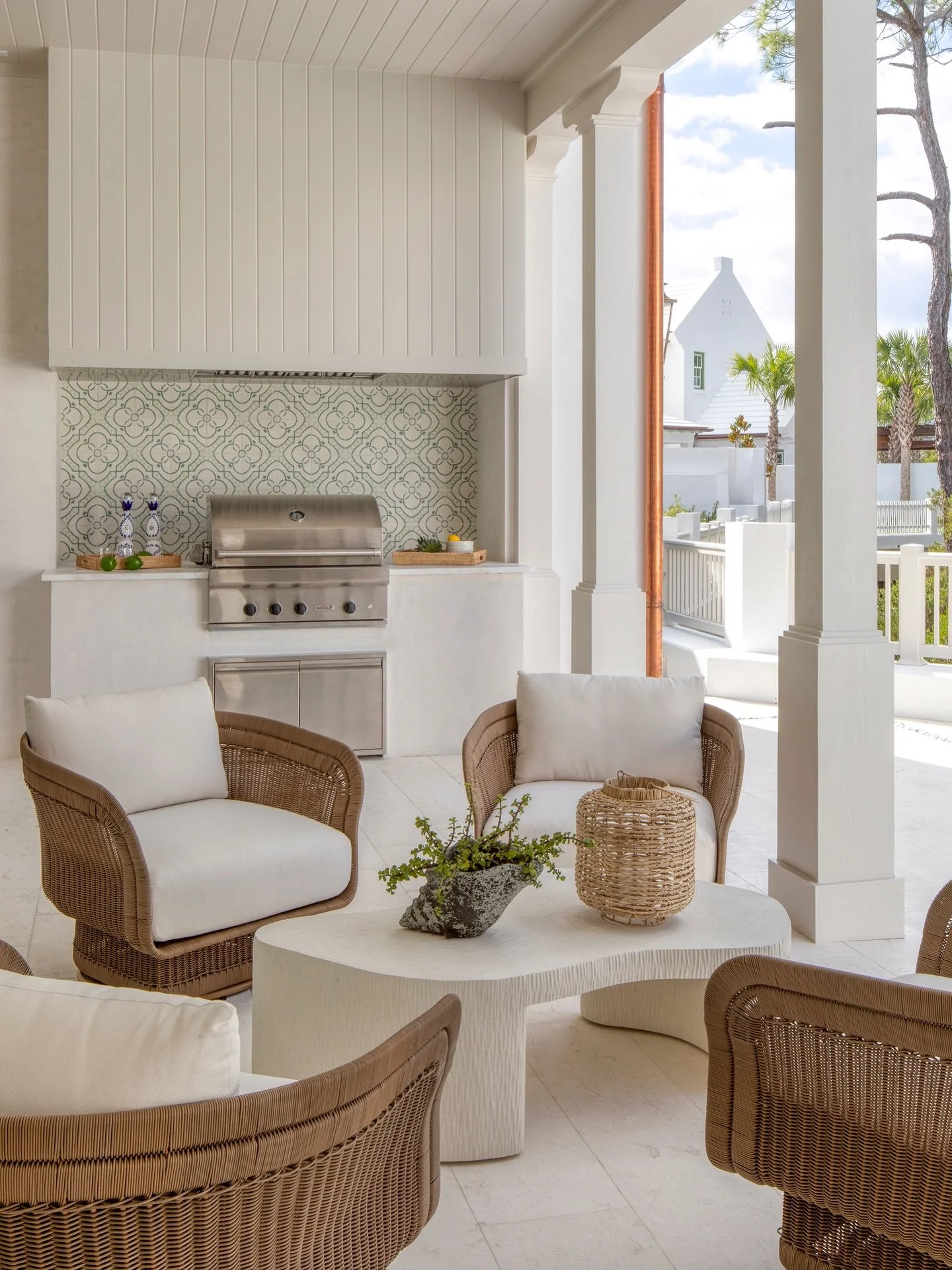 Designing outdoor spaces in Florida is all about making them feel just as thoughtful as the interiors. For this back patio, we carried the architecture through the covered porch and integrated the outdoor kitchen from the start, so everything feels c