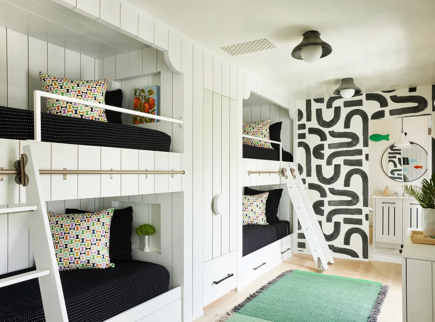 Built for fun and designed with intention, this playful bunk room and lounge is the ultimate retreat. Layers of color, texture, and classic black and white accents create a space that feels both lively and timeless.

Photography: @jallsopp 

#bunkroo