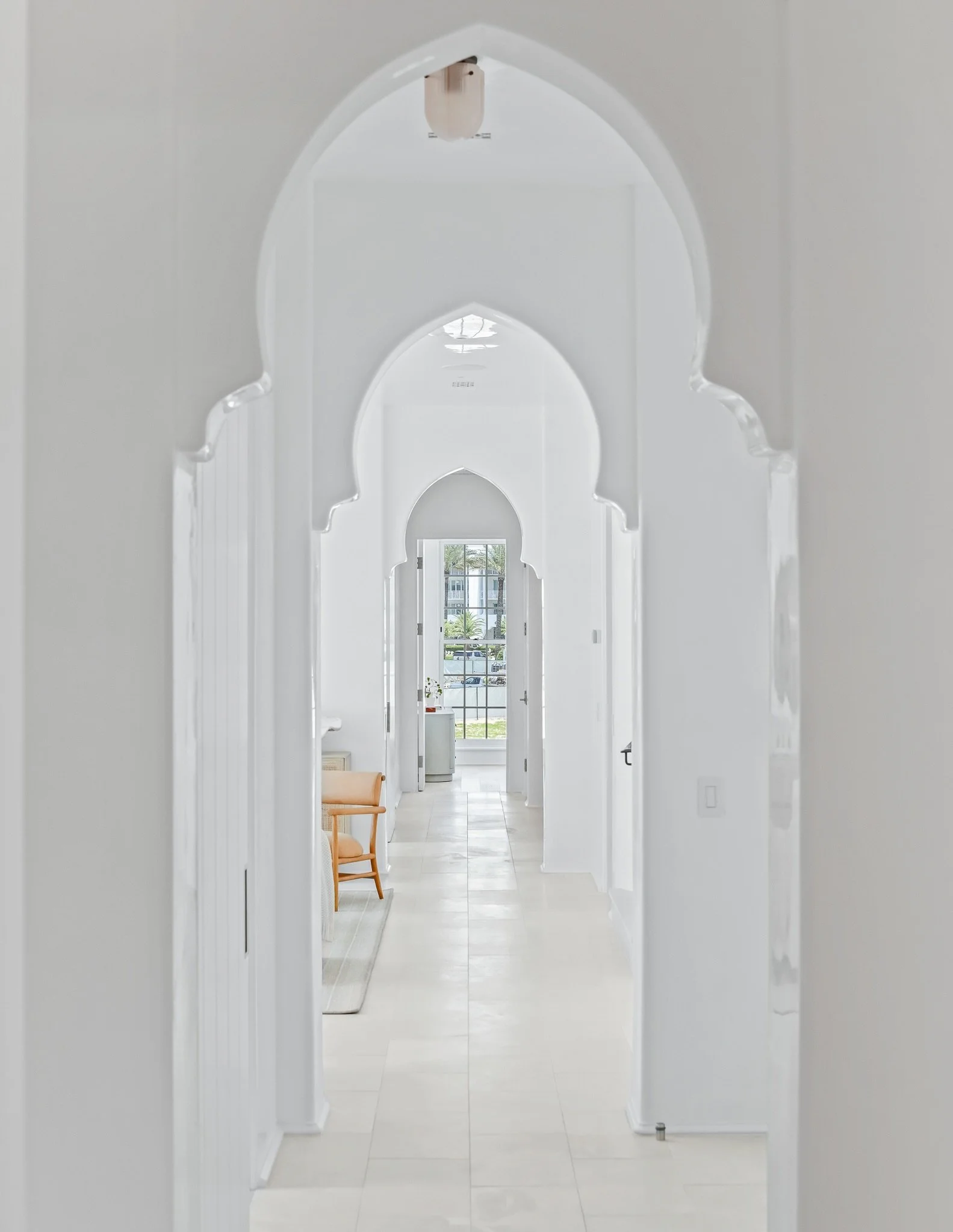 Some homes make a statement through color. This one does it through form.

Soft curves, sculptural archways, and reflective plaster walls create a quiet elegance that feels distinctly at home in Alys Beach. As natural light moves throughout the day, 
