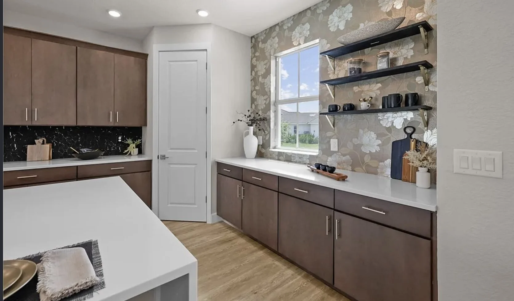 Kitchen in a new construction home redesigned by Khrome Interiors
