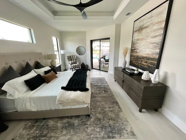 A modern, transitional bedroom set up for staging